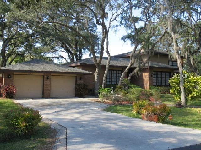 TARA VISTA, your home away from home awaits your arrival. This home is absolutely beautiful and it features 4 bedrooms, 2 1/2 bathrooms, separate living room, dining area and a bonus room directly off of the large screened in pool and spa area. This home sits on just under an acre of land on a dead end street with majestic live oaks and spectacular landscaping. Tara Vista is centrally located and within minuets of fine dining, shopping, downtown Sarasota, Siesta key, golfing and everything you would need to make this home your next vacation destination. Hurry this home wont be on the market long as it is also perfect for transitional housing while your home is being built or remodeled. Note: short term rental < 6 months will also require an additional 13% state and county resort tax in addition to the rental rate. Long term rental of > that 6 months there is no resort tax.