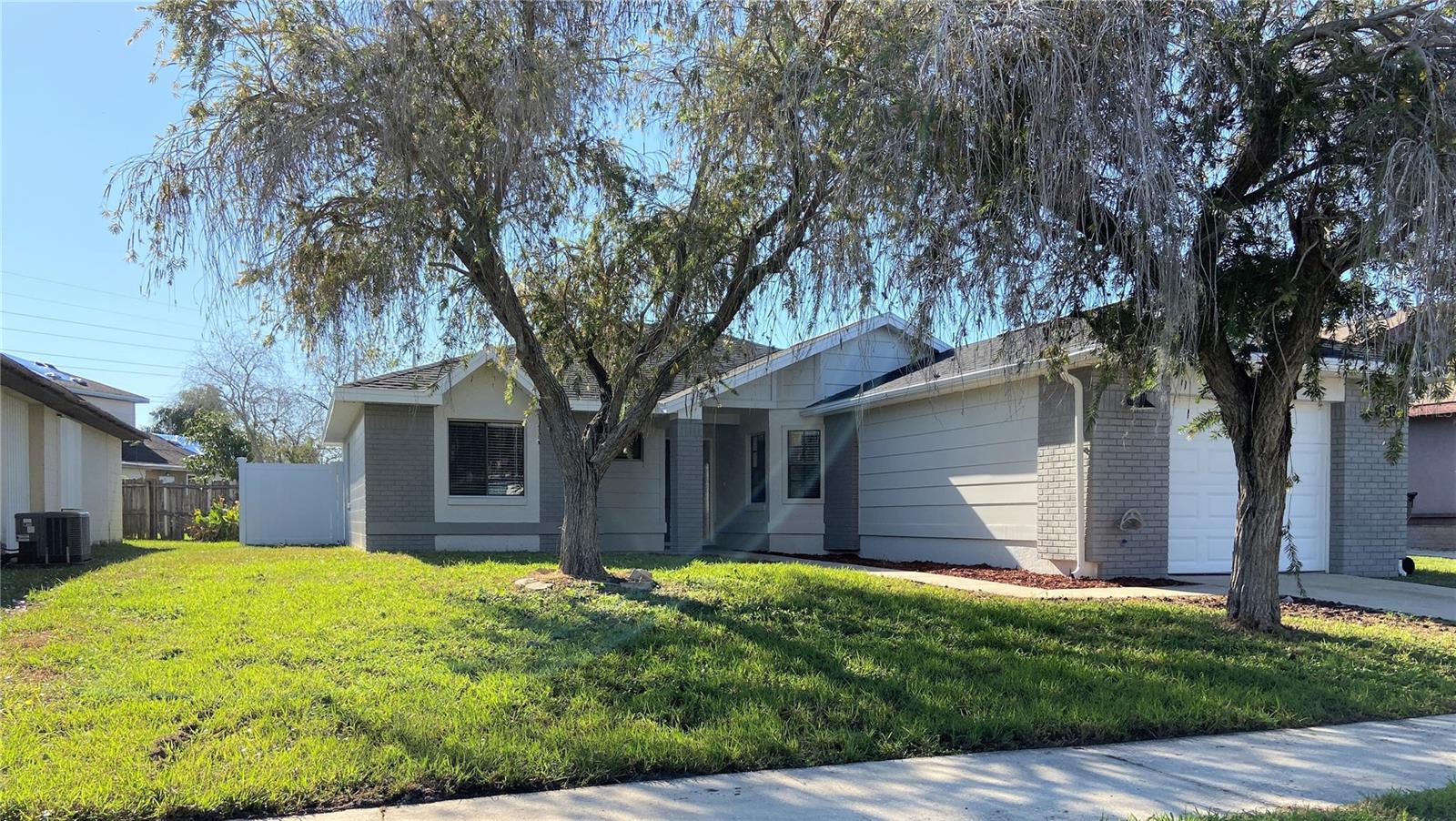 Available for immediate move in! You will love this gorgeous, renovated 3 bedroom, 2 bath home. Featuring vaulted ceiling, tile floors, and a one car garage in the well-established community of Meadow Woods. There are over 1,300 square feet of living space, a huge living and dining room combo which lead out to a spacious sun room. The kitchen offers plenty of counter space and has a breakfast nook. Master suite has his/her closets and a beautifully updated en-suite. Close to the Sun-rail station and a short drive away from 528, I-4, Central Florida Parkway, theme parks, shopping and restaurants. All applicants are required to do a credit and background check.**max 2 pets**
