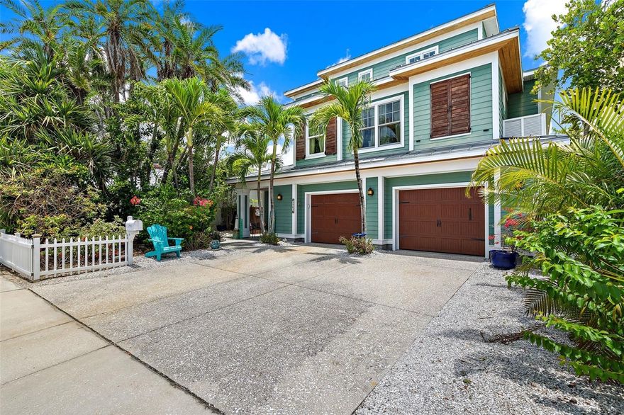 Welcome to your dream beach house at 2503 Pass A Grille Way located just steps away from the #1 Beach in the U. S.  This place is all about laid-back luxury.  Swim, fish, boat, relax, read and repeat.  With 2,912 square feet of space, this home has 3 comfy bedrooms including the primary on it's own level and two and a half baths. There are walk out decks on every floor seamlessly blending indoor and outdoor living. The high ceilings and open layout make it feel even bigger, and you'll love the stunning intracoastal and canal water views from almost every angle. The living room is perfect for gathering or entertaining, with its open floor plan,  hardwood floors and a cozy fireplace.  The kitchen is designed to incorporate conversation with cooking with it's cooking island and access to both the living and dining rooms. This main living level incorporates the two guest bedrooms, full bath and a power room along with the living, dining room and storage areas.  From the first floor garage area, you will surely appreciate the separate storage room, the outdoor kitchen and bonus space that can be enjoyed by opening the full overhead door to access the waterfront. Step outside to your own private oasis with a an in-ground pool (already plumbed for heating if desired) and a lush backyard that's just begging for a party.  The boat lift accommodates up to 10,000 lbs. with room for expansion. If you love fishing, you'll love coming right in from the water with your catch, cleaning it and getting it right on the grill. On the third level, the master suite is a true retreat, featuring its own sitting area, a custom walk-in closet, home office and even a secret room up the spiral stairs that could be used for crafting, reading, an extra sleeping loft or additional office. Enjoy your morning coffee on your private full length balcony overlooking the water and the sunrise.  The huge primary bath has dual sinks, a vanity area, a large shower and separate water closet. All floors are easily accessed by the three station elevator including the oversized three car garage with room for golf cart storage in addition to the three cars.  There is parking for two or three cars on the driveway as well -- a rare benefit in this beach community.  Whether you're lounging by the pool or taking a quick stroll to the beach, this home is all about living the salt life. Pass-a-grille is also home to great shops and restaurants, a marina, a fishing pier, a number of festivals and events and even more fantastic neighbors.  About 30 minutes from Tampa International Airport or St. Pete/Clearwater and 15 minutes from all that downtown St. Pete has to offer.  Come see it for yourself and make this slice of paradise yours!