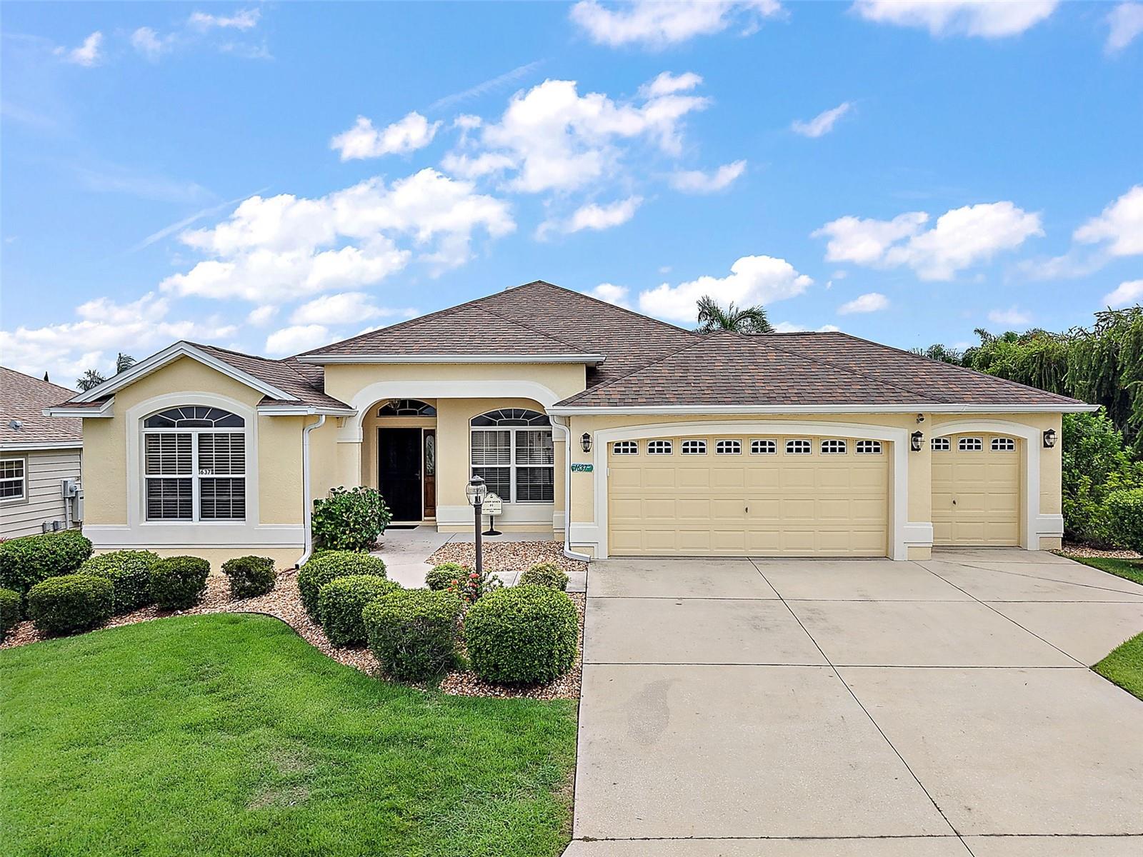 WELCOME to this HOME featuring 3 Bedrooms, 2 Bathrooms, a 2 Car garage and golf cart garage! This TURNKEY GARDENIA in the Village of Mallory is ready for its NEW owners. As you approach the home, you will notice the spacious corner lot that allows for a pool and is adorned with mature landscaping. Upon entering, you are greeted by the front porch and a half glass door flanked by glass sides. To the left, you will find two guest bedrooms along with a guest bath, which can be made private using the pocket door. The generously spacious kitchen includes a breakfast nook, bisque cabinetry with pullout features, GE appliances with a gas stove, and elegant gold hardware.
The owner's suite is expansive, featuring a vaulted ceiling, newer LVP flooring, and double walk-in closets. The en-suite bathroom boasts double sinks and a walk-in Roman tiled shower. Stackable sliding glass doors open to the enclosed lanai with acrylic windows, pull-down blinds, and river rock flooring. The laundry room comes equipped with a washer, dryer, cabinets, and a wash sink. Additionally, this home has a new ROOF and AC installed in 2023, diagonal tile in wet areas, 5 1/4" baseboards, 3 solar tubes, drop-down stairs for attic access, 2 carbon/smoke detectors, and was painted on the exterior in 2022, all located within minutes of LAKE SUMTER LANDING SQUARE! Don’t miss out on this opportunity to own a piece of paradise in The Villages!