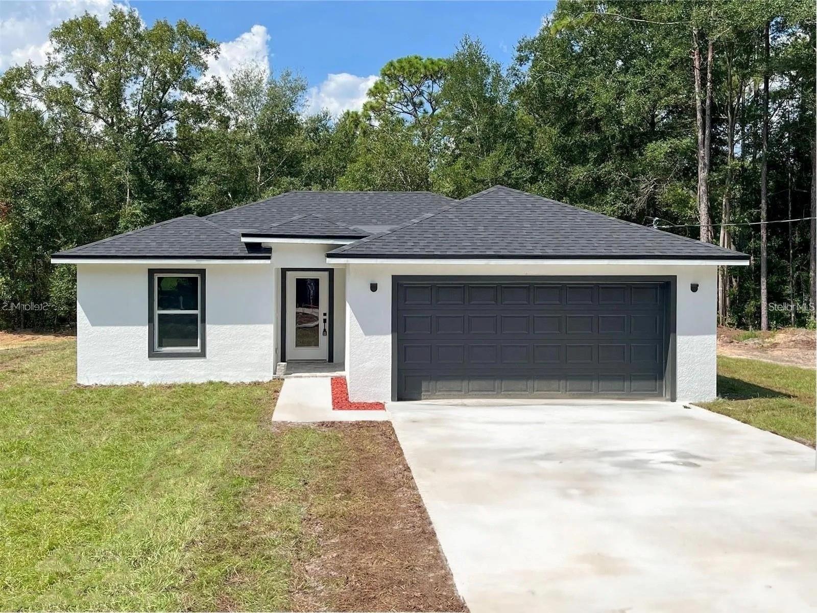 One or more photo(s) has been virtually staged. THIS BEAUTIFUL BRAND NEW HOUSE!! IS MOVING READY. come and live in the peacefull neighborhood of Daytona Prak States, close to the beach, shopping, a few minutes from downtown Deland, 40 minutes from Olando and team parks. this 3 bedromm,2 bath home would be right step to start a new life in a nice residential community. washer and dryer would be available and the most important, this house has a water filtration system.
its a corner lot that gives you more privacy and only one neighbor to your side. the peaceful ambiance would connect you with nature. applications would be process quick.