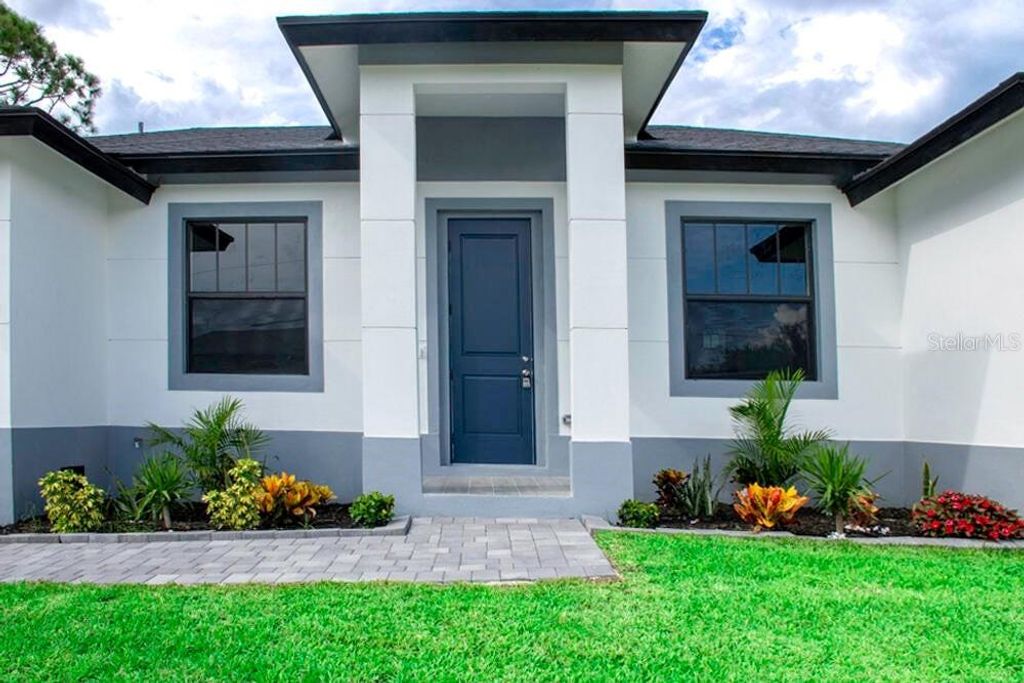 Photo of 15633 Lakeland Circle, Port Charlotte, FL 33981 (MLS # O6388465)