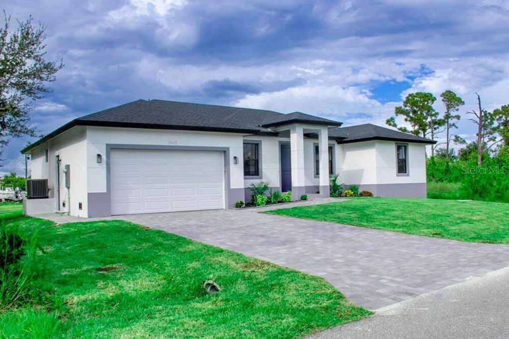 Photo of 15633 Lakeland Circle, Port Charlotte, FL 33981 (MLS # O6388465)