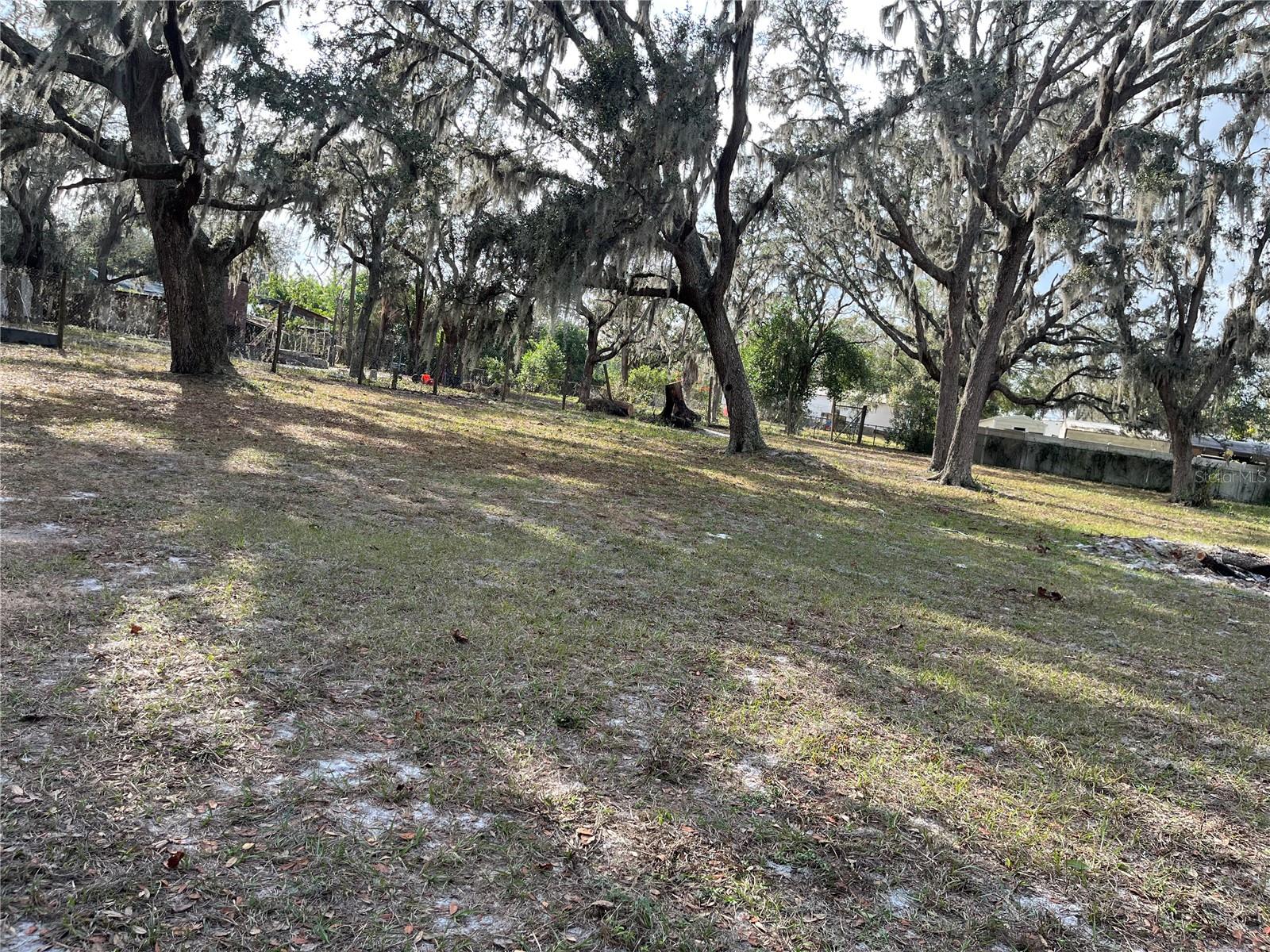 This property can be described as country living with city convenience! it is is situated on over 1.25 acres and is located in a very private, country setting. There is a studio apartment on the property which has both electric and gas. Build your dream home which can be either a single family home or manufactured home with the current zoning. The well, septic, and electric are on the property so no need to worry about impact fees! There are storage sheds and concrete slabs if you want to park an RV or for other uses. There is a ton of potential opportunities for this property. Bring your boat, RV, or other toys because there is no HOA! A single family homes was previously on the property but was destroyed by a storm. The chimney is still standing. The location is near the famous Strawberry Festival and just a few miles to Strawberry Crest High School. This property is near I-4 and I-75 for a very easy commute to Tampa, Lakeland, & Orlando! A Prime location with just a short drive to shopping, restaurants, wineries, Hard Rock Casino, theme parks, and beautiful Florida beaches!