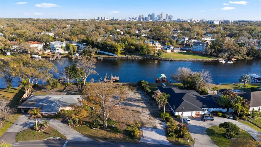Build your dream home on this exceptional 90x190 riverfront lot totaling 17,100 sq ft, offering breathtaking views of Downtown Tampa. Perfectly positioned along the river, this rare homesite features a private dock with boat lift already in place—ideal for enjoying waterfront living and easy access to the bay. With generous dimensions and stunning city skyline views as your backdrop, this property presents endless possibilities to design and build a custom residence tailored to your vision. A truly unique opportunity to create something extraordinary in one of Tampa’s most desirable waterfront settings.