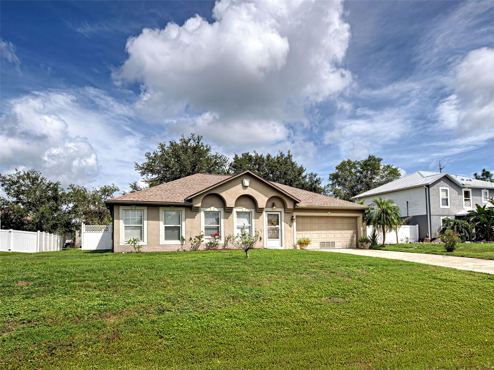 Spacious home in nice area with no MANDATORY HOA or CDD FEES OR EXTREME RULES. Come live the Florida Lifestyle! This home is very conveniently located. It is near shopping, restaurants, golf courses, beaches and all that the area has available. The home has recently had updates to the mechanicals: ROOF 2022, A/C 2019, Water Heater 2018. This home is NOT in a high-risk FLOOD ZONE, so you should not be required to carry flood insurance (confirm with lender/insurance).
The home has plenty of room to stretch out. A true split floor plans offers privacy for all. The vaulted ceilings really add to overall feel. The large kitchen with generous sized island. There are 2 pantries and 2 sinks that should appeal to the gourmet. There are two large living spaces and an office for those that may work remote.
There is a screened lanai and fenced portion of backyard allowing you to get outside and enjoy the beautiful weather. This home is a MUST SEE.