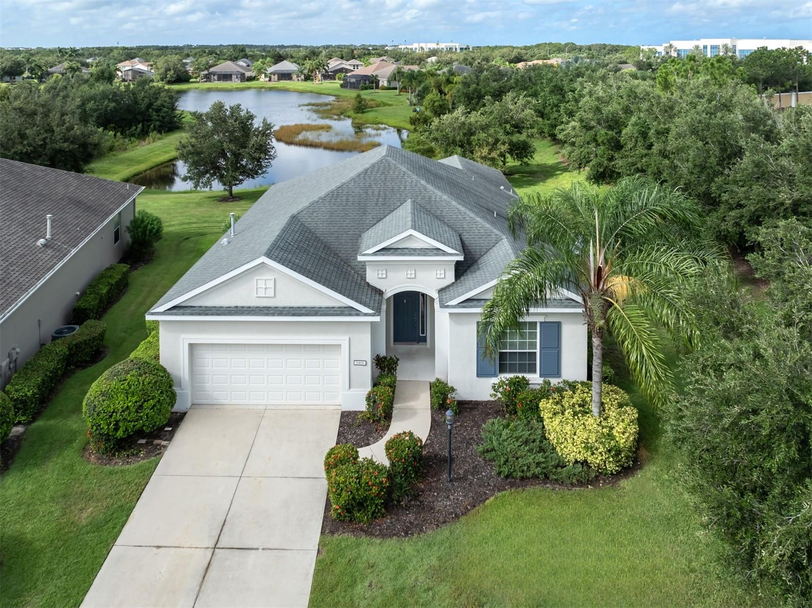 *BRAND NEW A/C UNIT installed May, 2025*Community Pool* Maintenance FREE* Welcome to the highly sought-after, maintenance-free living community of Central Park in Lakewood Ranch. This immaculate 3-bedroom, 2-bathroom home, with an additional den, offers 2,148 square feet of thoughtfully designed open living space. Nestled on a peaceful cul-de-sac and a water view, this residence combines privacy with beauty. Upon entry, you are welcomed by an open-concept floor plan that seamlessly integrates elegance with functionality. The modern kitchen, featuring stainless steel appliances, granite countertops, and ample cabinetry, is designed for both the cooking enthusiasts and those who enjoy hosting. The master suite serves as a private retreat, offering spacious walk-in closets and a en-suite bathroom complete with dual vanities. Two additional well-appointed bedrooms offer ample space for family, guests, and a large den for a home office. Step outside onto the screened lanai and enjoy the serene, private backyard with a tranquil water view, an ideal space for relaxation or outdoor activities. The cul-de-sac location ensures minimal traffic, making it a safer and more peaceful environment for families. As a resident of Central Park, you will have access to a wide range of community amenities, including (Heated swimming pool), two dog parks, playgrounds, a splash park, and picnic pavilions ideal for family gatherings. Enjoy tennis and pickleball courts, as well as baseball and soccer fields, all set amidst miles of scenic walking and biking trails. This home is centrally located within Lakewood Ranch, providing convenient access to top-rated schools, shopping, dining, and entertainment options. Don't miss the opportunity to own a home in one of the most desirable neighborhoods in Lakewood Ranch. Schedule a private tour today and discover the perfect combination of comfort, and community.