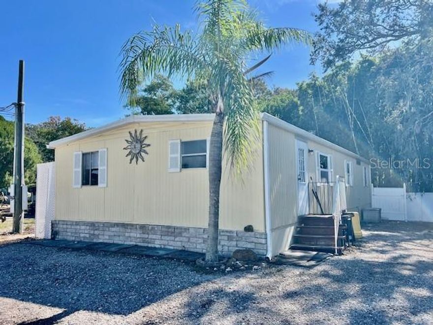 WELCOME TO YOUR SWEET HOME at 1216 Live Oak Pkwy, Tarpon Springs, FL in the SUPERB community of Leisure Lake Village, a NON-55+ community in SUNNY Florida. This 1980 DOUBLE-WIDE MANUFACTURED HOME features 3 bedrooms & 2 bathrooms with 1152 sqft [home dimensions are 48'x24'.]. Your new home lies on a parallelogram lot of nearly 3500 sqft with NO REAR NEIGHBORS in a non-flood zone. Key exterior features are FANTASTIC man-cave/she-shed, PAVERED patio within the wood fenced side yard, vinyl fencing & mature bamboo along back perimeter, rain gutters, private mailbox, easy-breezy TROPICAL landscaping & PLENTY of off-street parking. Stepping inside, you'll really like the OPEN FLOOR PLAN consisting of the kitchen, dining & living rooms. The ceilings are HIGH, the rooms are SPACIOUS & bedrooms feature the POPULAR split plan. Your new home features BRAND NEW laminate floors in the living & dining rooms & all 3 bedrooms. A FRESH coat of paint brightens up the space. The updated kitchen has SOLID WOOD cabinets, new range, pantry closet & ceiling fan. In fact, the multiple ceiling fans circulate COOL BREEZES. The primary bedroom can fit king size furniture & has a private en-suite. This private bathroom consists of ceramic tile floor, expansive cabinet with storage & step-in shower with bench & shelves. The remaining 2 bedrooms are located on the opposite wing of the home near the guest bathroom. ALL the bedrooms have WALK-IN CLOSETS! The guest bathroom feature mirrored medicine cabinet, vanity with storage, linen closet & tub/shower combo with safety grip handle. The washer & dryer are included for tenants' use. To rent this home, association approval is required & move-in deposits are 1st month's rent, last month's rent & $1000 for security deposit. For pet owners, a monthly fee of $40/pet is due & renter's insurance is required. Leisure Lake Village is a lovely community where PETS ARE WELCOME. Launch your kayak, paddle board or even jet ski via the community boat dock onto Salt Lake. Location is IDEAL near the Pinellas Trail, beaches, shopping, restaurants, medical plazas, places of worship & tourist attractions. MAKE THIS YOUR FUTURE HOME!