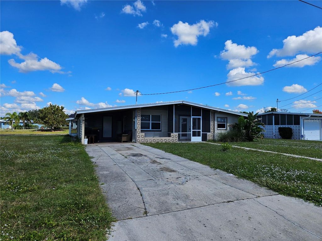 Photo of 125 Poinsettia Circle NE, Port Charlotte, FL 33952 (MLS # TB8438826)