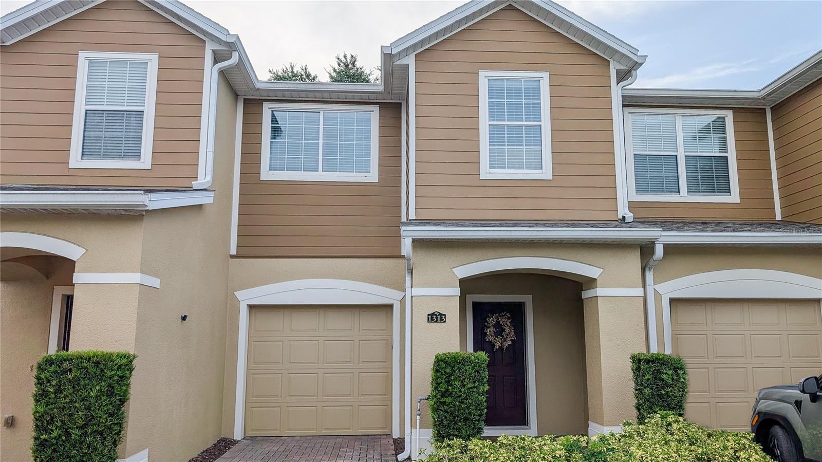 There are so many things to love about this gorgeous 3 bedrms, 2.5 bath townhome! It's been immaculately maintained so it shows like new. This beauty has undergone some great recent improvements including a new a/c, all new appliances, fresh paint throughout, and even a few smart home upgrades. Have an electric vehicle? this home is equipped with a level 2 EV charger! This neighborhood is gated and features an attached single car garage for all residents, plus a beautiful community pool and clubhouse! You'll love that you are just a short walk to Publix, shopping, and dining just outside the neighborhood. If you're staying home, you'll appreciate that there are no rear neighbors giving you the ultimate privacy. Book your showing today and check out the open floorplan, natural light, and beautiful kitchen this home has to offer!