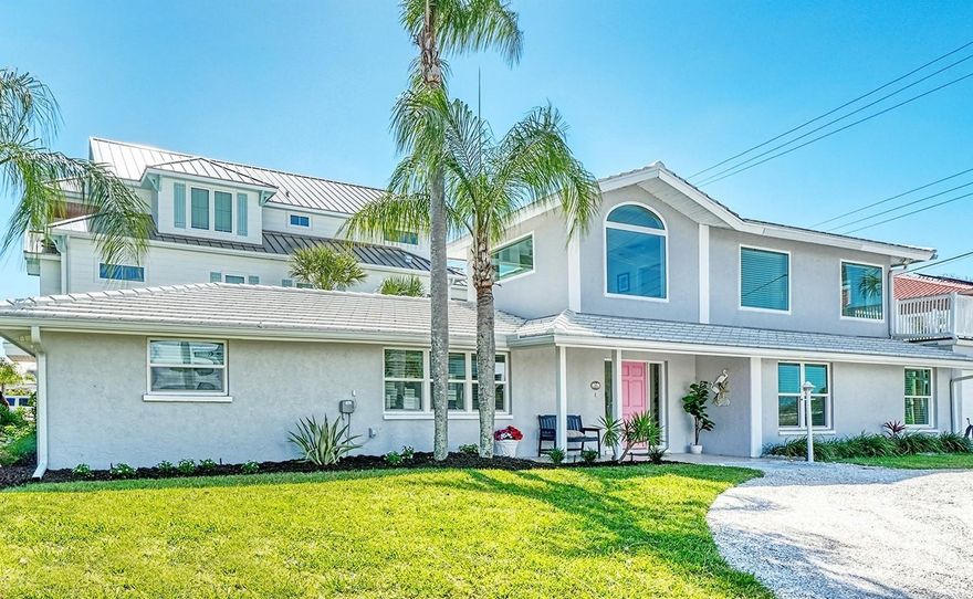Welcome home to 404 S Polk — A Phenomenal Coastal Retreat on Lido Key-- Timeless beach charm meets modern ease in a bright, airy home that’s been loved, enjoyed, and meticulously maintained by the same family for 65 years.
Impeccably renovated and extended with both families and beachgoers in mind, this 4BR/3BA residence sits on a SPRAWLING CORNER LOT with a grassy front yard and a fenced-in backyard patio and dining area perfect for grilling your fresh catch.
Effortless indoor/outdoor living flows from two primary suites (one on the main floor and one upstairs) to a bright and open VAULTED CEILING entryway, a welcoming family room, casual dining area, and a separate formal dining room. IMPACT WINDOWS & SLIDERS provide relief for out-of-state owners. Sleek, updated kitchen featuring granite countertops and stainless steel appliances, alongside updated baths and a NEWER ROOF for peace of mind.
An ideal setting for every lifestyle — family living, long-weekend getaways, vacation memories, or a weekly rental property with $205k  estimated annual rental income (see attached).  Prime location just STEPS from the powdery quartz-sand beaches and turquoise waters of Lido Key. The 2nd-floor balcony is your front-row seat for cool Gulf breezes, beach views, and spectacular bright orange sunsets. Parking is a premium on the beach, but this home has plenty of space with a tandem 2-car garage, and space for 3 cars in the circular driveway! A 4-minute walk to Lido Beach Pavilion: public pool, on-beach dining (including lobster roll favorites), covered seating areas, and convenient beach equipment rentals. 
St. Armands Circle is about half a mile away, offering restaurants, boutique shopping, live music, and entertainment.
Easy access to Sarasota’s Bayfront, theaters, opera, and museums via a short drive over the John Ringling bridge.