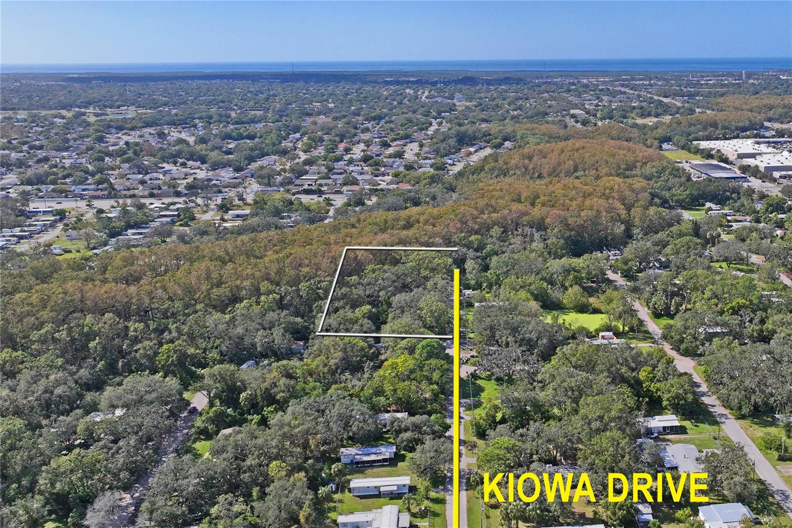 This half-acre of vacant land, not located in a mobile home park, comes with full ownership rights. Previously accommodating four mobile homes, it offers the potential to be subdivided into four separate lots. Ideal for creating a family estate or as an investment opportunity. While the septic system has been removed, a well remains on the property. Benefit from nearby shopping, dining, parks, and convenient airport access. Plus, the beach is a mere 15-minute drive away!