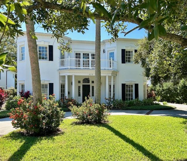 The search for THE statement house stops here. This elegantly handsome Regency mansion is a rare gem crowning Azeele's estate row.  Custom crafted, thoughtfully updated, 4318 hearkens back to a time where stylish lines and elegant proportion turned heads.  The gracious columned portico ushers you into the large entrance hall with its romantic, sweeping staircase; the perfect axis to lead you through the house, as you conjure the possibilities of family living and gracious entertaining.  Living room, custom-fitted library with a hint of a British accent, large family room with fireplace, brightened by walls of French doors, and glowing hardwood floors, all flow easily to one another, and to the large formal dining room, through the butler's pantry to the elegant, sunny kitchen and breakfast room, past the downstairs guest room with its French doors to the pool courtyard, out to the bright, elegant pool surrounded by intimate gardens, pool storage and oversized garage.
Upstairs the Master takes over one wing with its large bedroom, dressing room and bath, inviting fireside seating, and French doors to the poolside balcony.   There's a kid's-dream fitted bedroom/playroom and then two more bedrooms and baths up here, with balconies peeking through the oaks, overlooking the front yard and pool in the back. Cannot be duplicated at this price.
In the coveted cradle of South Tampa; so ez to the airport and interstate.  NO FLOOD DAMAGE