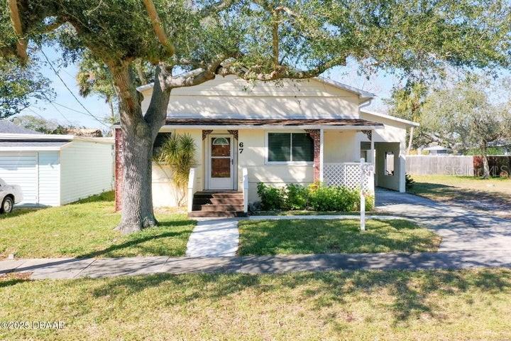 f you are looking for a home that is in the middle of everything but still feels quiet PLUS everyone can have their own space without being cramped, this is one to see! The master suite off the front entry has a fenced, private deck (with a doggie door for your Fido friend!) as well as a bedroom large enough for a sitting area. You could set up the front den as a library, office, or playroom - be close to everyone, but with enough separation. The split floor plan has the second bedroom and bathroom at the rear of the home - perfect for guests or those just needing privacy. And the desk nook under the stairs is right off that second bedroom, almost like a second bedroom suite. Upstairs, the third bedroom with built-in desk makes a great teen suite! Or it could be used as a flex space like a movie or game room. The living room, dining room, and kitchen open into each other, which is great for entertaining and daily life. And you are sure to love the eat-in kitchen for cozy brunch in