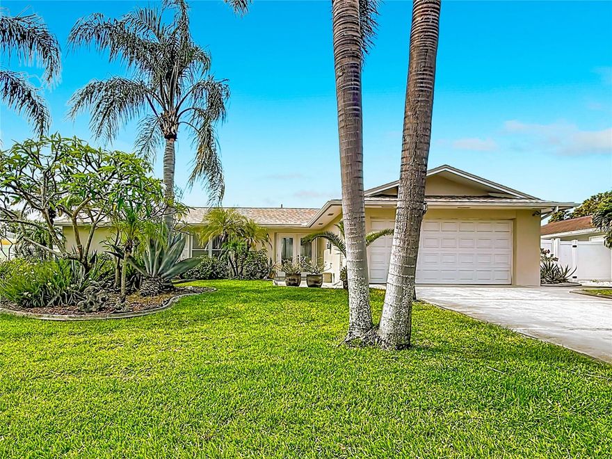 LOCATION-LOCATION-LOCATION!! This beautiful pride-of-ownership home sits in the highly sought-after Coastal Enclave of Hamlin Gardens, near Indian Rocks Beach. The kitchen features solid wood JSI cabinets, granite counters with Breakfast Bar and a tumbled marble backsplash. Both the Shingle Roof & Insulated Flat Roof were replaced in 2021. The Central A/C is just a year old, and a brand-new 200-amp electric panel was installed in April 2026. The deep water well and pump ($8,000) keeps the lush landscaping and St. Augustine grass thriving. The tropical backyard, enclosed by a 6-ft white vinyl fence, offers privacy and outdoor space—complete with banana trees nearly ready to harvest. Enjoy peace and quiet with the rectory of St. Jerome Church as your only rear neighbor. The double-door entry leads to a stylish foyer with a fancy tiled inlay and coat closet. Both bedrooms have ensuite baths for comfort & privacy. The primary bath features a gorgeous vanity with quartz counter and beautiful tile extending three feet up the wall. Energy-efficient Thermopane windows save money and keep you comfortable all year round. Porcelain Tile floors run through-out the entire home, meaning NO CARPETING. The sunny glass-enclosed Florida Room is an additional 312 square feet.  110th Terrace is lined with upscale, well maintained nearby homes & sits Just 1.3 miles from Indian Rocks Beach & It's “Restaurant Alley”. This Un-Incorporated community has no HOA, allows vacation rentals, and lies in Flood Zone X—outside the floodplain, so no lender flood insurance required.  Plus, it's in a NON-EVACUATION zone, thanks to its elevation, for peace of mind during hurricane season.   This Awesome location is packed with close-by conveniences. Indian Rocks Beach & the other glorious Gulf beaches start just five minutes away! Publix Supermarket, Wal-Mart Neighborhood Store, Walgreens, and CVS are all within a two-minute drive. The Largo Municipal Golf Course and Southwest Recreational Complex, featuring the Largo Tennis Center with eight clay courts, are just around the corner. Countless other businesses & eateries are within 1 mile.  Heritage Village and the expansive Walsingham Park are a short drive away. St. Pete/Clearwater International Airport is 25 minutes away, and Tampa International Airport is 45 minutes away. Truly a must see!