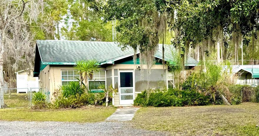 Waterfront bungalow on a CANAL leading to beautiful LAKE KERR! This charming 2-bedroom, 2-bath home is full of character and functionality, featuring a whole-house generator for peace of mind during those stormy weather nights. Inside, you’ll find a spacious family room, a desirable split floor plan, a large primary suite with a private en-suite bath, and a second full bath conveniently located at the rear of the home. The home also showcases its original 1950s kitchen complete with a gas cooktop. In this home all appliances convey, including two refrigerators (one with an ice maker), a washer and dryer, a dishwasher, a microwave, a convection toaster oven, and a toaster—making this home truly move-in ready! Outside, the property offers a large workshop, a detached laundry room, and two sheds. The larger shed includes an attached carport, and even the riding mower conveys with the sale! Whether you’re looking for a full-time residence, a weekend getaway, or an excellent Airbnb opportunity, this one-of-a-kind canal-front home checks all the boxes! Call today to make it yours!