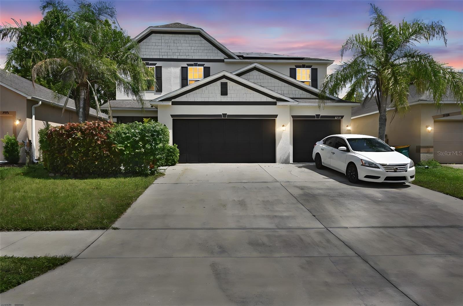 Welcome to 2382 Norwood Place, a beautifully maintained 4-bedroom, 2.5-bath home with a 3-car garage located in the quiet community of Martin’s Grove. Built in 2014 and recently updated with a brand-new AC, enclosed front porch (2024) and fresh exterior paint (2024), this spacious two-story home blends modern convenience with thoughtful design. Step inside the foyer and you’ll find an expansive open floor plan that spans the main living area, perfect for entertaining or everyday living. The kitchen is a chef’s dream, offering abundant cabinet and counter space, a large prep island, and an additional island for even more functionality. The kitchen flows seamlessly into the breakfast nook, where sliding glass doors fill the space with natural light and open to the backyard patio with privacy fencing—ideal for indoor-outdoor living. Upstairs, all four bedrooms provide comfortable retreats, while the spacious laundry room adds everyday convenience. The primary suite is a true standout, featuring a tray ceiling, two oversized walk-in closets, and a private en suite bath. Martin’s Grove offers a peaceful neighborhood setting while keeping you close to shopping, dining, and just minutes from downtown Tavares and the charming streets of historic Mount Dora. With its combination of space, updates, and location, this home is ready for its next owner to enjoy.