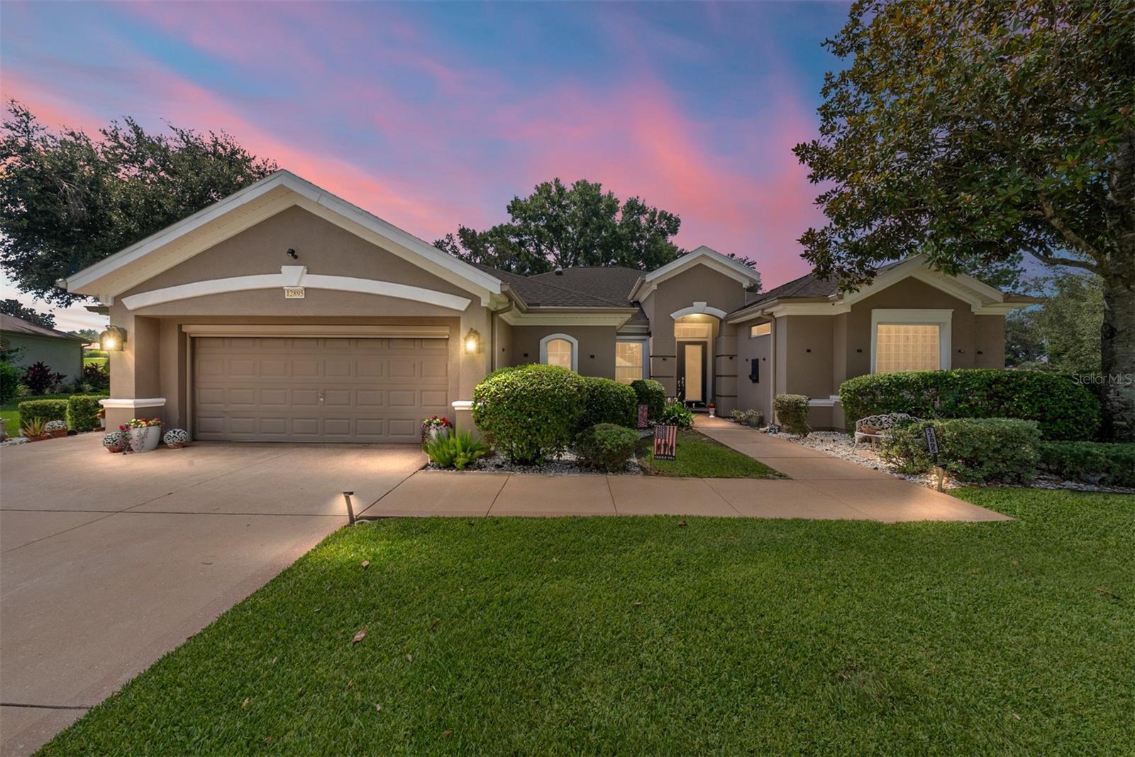 GOLF COURSE home with tons of updates and upgrades located in Del Webb’s Spruce Creek Golf & Country Club in Summerfield, just North of The Villages. This community is a 55+ community, 24/7 Manned Guard Gates, Citizen Patrol, over 70 clubs, 3 pools and hot tubs, Pickleball & Tennis Courts, Softball Field and so much more! This Hampton model has so much to offer not to mention being a golf course home located on a cul-de-sac lot (8th hole of the Memorial Course): Home was expanded at build from original floor plan, Roof replaced in 2021, Lanai Windows in 2022, Birdcage in 2021, HVAC in 2025/2015, New Solar Tubes (4), SS Appliances, New Washer & Dryer, New Water Softener System, Epoxied Garage Floor & Designer Drive & Walk, Automatic Screens on Main Garage Door and Golf Cart Garage Door, Glassed in Lanai under Heat & Air (an add'l 400 sf apprx), Newer Hot Water Heater, Attic Storage, Double Front Doors with Beveled Designer Glass Inserts, His & Her Primary Closets, All Blinds are Brand New, Pendant Lighting over Breakfast Bar, Granite Countertops and Tin Backsplash, Built-in Bookshelf in Back Foyer, Roman Shower in Primary Bathroom with split vanities, Garage Doors are Insulated and so much more. There is also a Shared Irrigation Well located on the Property. (Taxes DO NOT reflect Homestead Exemption.) Seller is offering a 1 Year Broward Factory Service Home Warranty. Come see this spectacular home today!