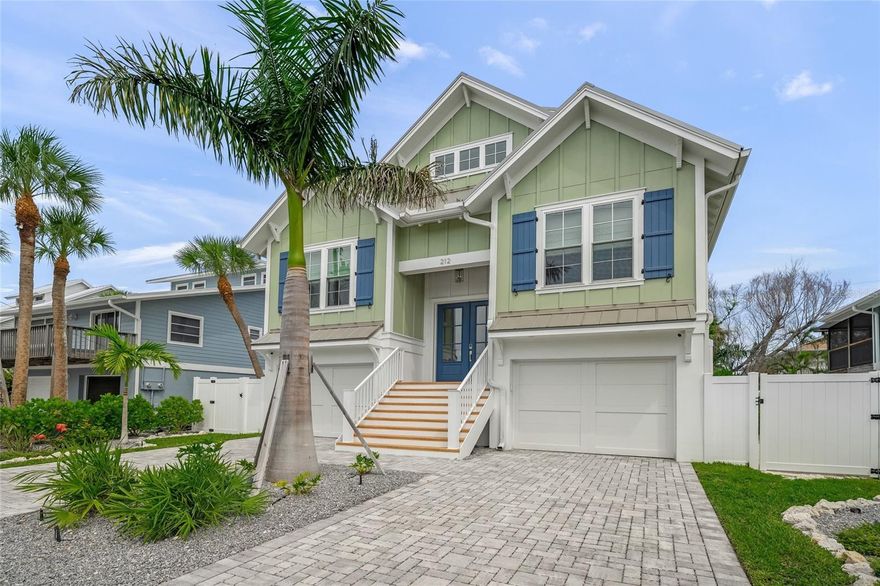 Welcome to your slice of paradise—this breezy, 4-bedroom, 4.5-bath island retreat is just one block from the powdery white sands of world-famous Anna Maria Island beaches. This home was built by Moss Builders and thoughtfully designed by Emily Moss Designs with both comfort and style in mind, this coastal home invites you to unwind in true island fashion.
Take a dip in your private pool and spa surrounded by low-maintenance landscaping and turf—perfect for barefoot afternoons. Enjoy Gulf breezes and sunset views from the rooftop deck or sip your morning coffee on one of the covered balconies.
Inside, an open-concept living, dining, and kitchen space makes entertaining a breeze. Each of the 4 bedrooms has its own ensuite.  The home is equipped with an elevator and 2-car garage for added ease and convenience.
With a champagne metal roof, thoughtfully designed indoor-outdoor living spaces, and privacy throughout, this home offers everything you need to settle into the laid-back island life.