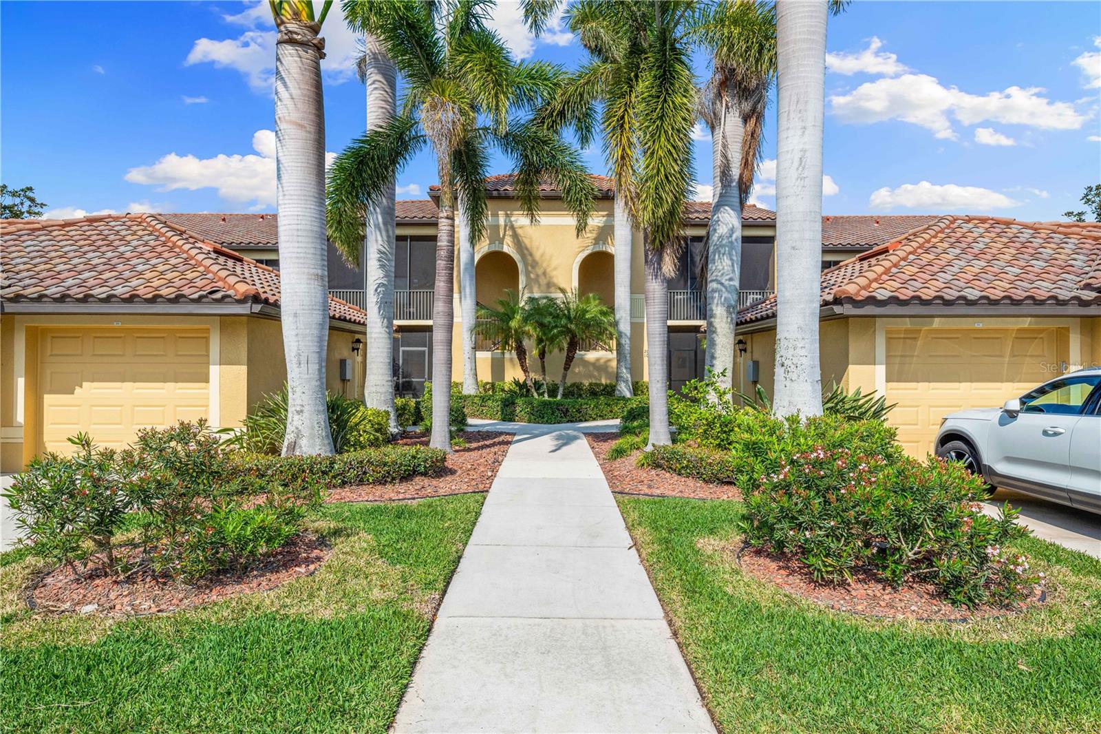 TURNKEY, FURNISHED, GOLF MEMBERSHIP INCLUDED! Move right into this beautiful, first floor, former "Abbey" Model, Veranda home. Relax on the spacious screened-in back lanai overlooking both Estuary & Sanctuary's 8th holes. This unit includes a Golf Deeded Membership to the meticulously maintained 27 hole, Arthur Hills Designed Championship Golf Course. It is a home that any golfer will appreciate. Also enjoy the newly renovated Clubhouse, restaurant and grille room, pro shop, 2 community pools, spas, tiki bar, 2 fitness centers, 6 satellite pools, pickle ball and tennis courts, and many social activities. This end unit is very appealing to those that love lots of natural light and a quick walk to the pool. Welcome your guests on the front screened lanai! Spacious, newly furnished, living room with sliding doors lead to the back lanai. Dining room with a dry bar. Updated light fixtures. Kitchen with lighted tray ceiling, crown molding, stainless steel appliances, granite counter tops, breakfast bar, pantry, and a great eating area. The split bedroom floor plan offers privacy for your guests. Separate laundry room. The Den offers additional sleeping space or a private office. The Primary bedroom overlooks the golf course and ponds, two separate walk-in closets, and a ensuite, including a separate shower, soaker tub, split sinks, and a water closet. Detached one car garage for parking, beach toys, or golf cart. Easy access to shopping, restaurants, I-75, and beautiful beaches!