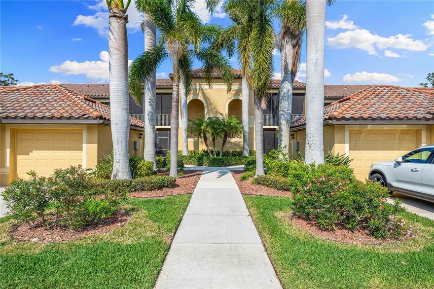 TURNKEY, FURNISHED, GOLF MEMBERSHIP INCLUDED!  Move right into this beautiful, first floor, former "Abbey" Model, Veranda home.  Relax on the spacious screened-in back lanai overlooking both Estuary & Sanctuary's 8th holes.  This unit includes a Golf Deeded Membership to the meticulously maintained 27 hole, Arthur Hills Designed Championship Golf Course.  It is a home that any golfer will appreciate.  Also enjoy the newly renovated Clubhouse, restaurant and grille room, pro shop, 2 community pools, spas, tiki bar, 2 fitness centers, 6 satellite pools, pickle ball and tennis courts, and many social activities.  This end unit is very appealing to those that love lots of natural light and a quick walk to the pool.  Welcome your guests on the front screened lanai!  Spacious, newly furnished, living room with sliding doors lead to the back lanai.  Dining room with a dry bar.  Updated light fixtures.  Kitchen with lighted tray ceiling, crown molding, stainless steel appliances, granite counter tops, breakfast bar, pantry, and a great eating area.  The split bedroom floor plan offers privacy for your guests. Separate laundry room.  The Den offers additional sleeping space or a private office.  The Primary bedroom overlooks the golf course and ponds, two separate walk-in closets, and a ensuite, including a separate shower, soaker tub, split sinks, and a water closet.  Detached one car garage for parking, beach toys, or golf cart.  Easy access to shopping, restaurants, I-75, and beautiful beaches!