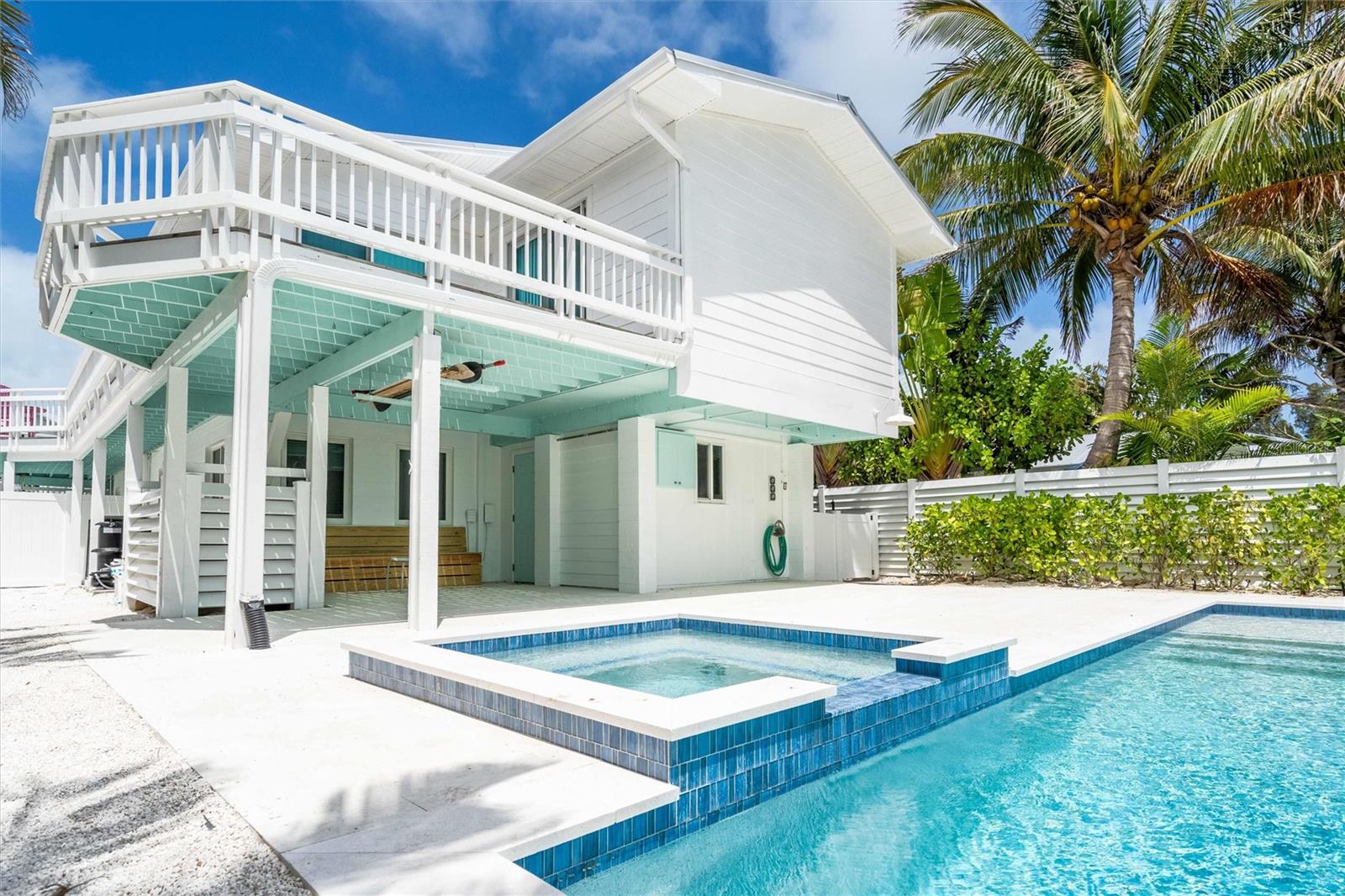 Brand new pool and price improvement! Located just steps from Bean Point on the northern tip of Anna Maria Island you will find this lovely furnished duplex. This rare property consists of two units, both levels are 3 beds and 2 baths. The upstairs unit has a wonderful wrap around deck perfect for lounging or al fresco dining. Once inside, you are welcomed with warm beach decor and partial views of the water from the living room on the second level. The two units allow for you to have the capability to rent out both units, keep one for yourself and rent the other, or a large family could occupy both levels. Recent upgrades (2023) include exterior paint, metal roof, Hardie board siding, and a beautiful saltwater pool with a spa. The current owner does carry flood insurance which would be assumable to any buyer. Call now to schedule your private showing!