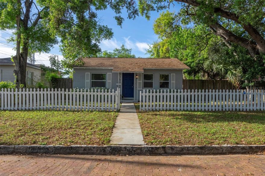 Step into the charm of this move-in-ready, fully furnished bungalow in the highly sought-after Central Oak Park neighborhood, where timeless character meets modern convenience. Framed by a classic white picket fence and set on a spacious 51x127 lot, this 2-bedroom, 1-bath home with a bonus flex-room offers the perfect blend of comfort, flexibility, and Florida living.
From the moment you arrive inside, a bright, open-concept layout showcases beautiful wood-look ceramic tile flooring throughout, offering the warmth of wood with durability and easy maintenance. A beautifully crafted architectural archway connects the kitchen and living room and continues into the hallway leading to the bedrooms and bath, adding distinctive charm and architectural interest. The updated kitchen features stainless steel appliances, granite countertops, and an informal dining nook, ideal for everyday living or morning coffee.
A flexible bonus space, perfect as a home office, den, or dining room, offers endless possibilities and enhances the home’s functionality. Sliding doors lead to a private side patio with a firepit, creating the perfect setting for outdoor gatherings. The oversized covered patio features a separate private entrance from the bonus room, offering added convenience and versatility, and can easily function as an outdoor entertaining area or carport, in addition to the one-car garage and convenient alley-access parking.
Both bedrooms are generously sized with abundant natural light, and the home includes a Ring doorbell, exterior cameras, and ADT security system. With a 2013 roof, 2013 HVAC, and 2022 water heater already in place, this home delivers added confidence and value—plus the advantage of being situated in a non-flood zone.
The fully fenced property provides solitude and safety, all while being just minutes from downtown St. Petersburg, award-winning beaches, dining, shopping, and entertainment, making this an exceptional opportunity for a primary residence, vacation home, or income-producing investment.
Don’t miss your chance to own this Central Oak Park gem, where location, lifestyle, and value come together.