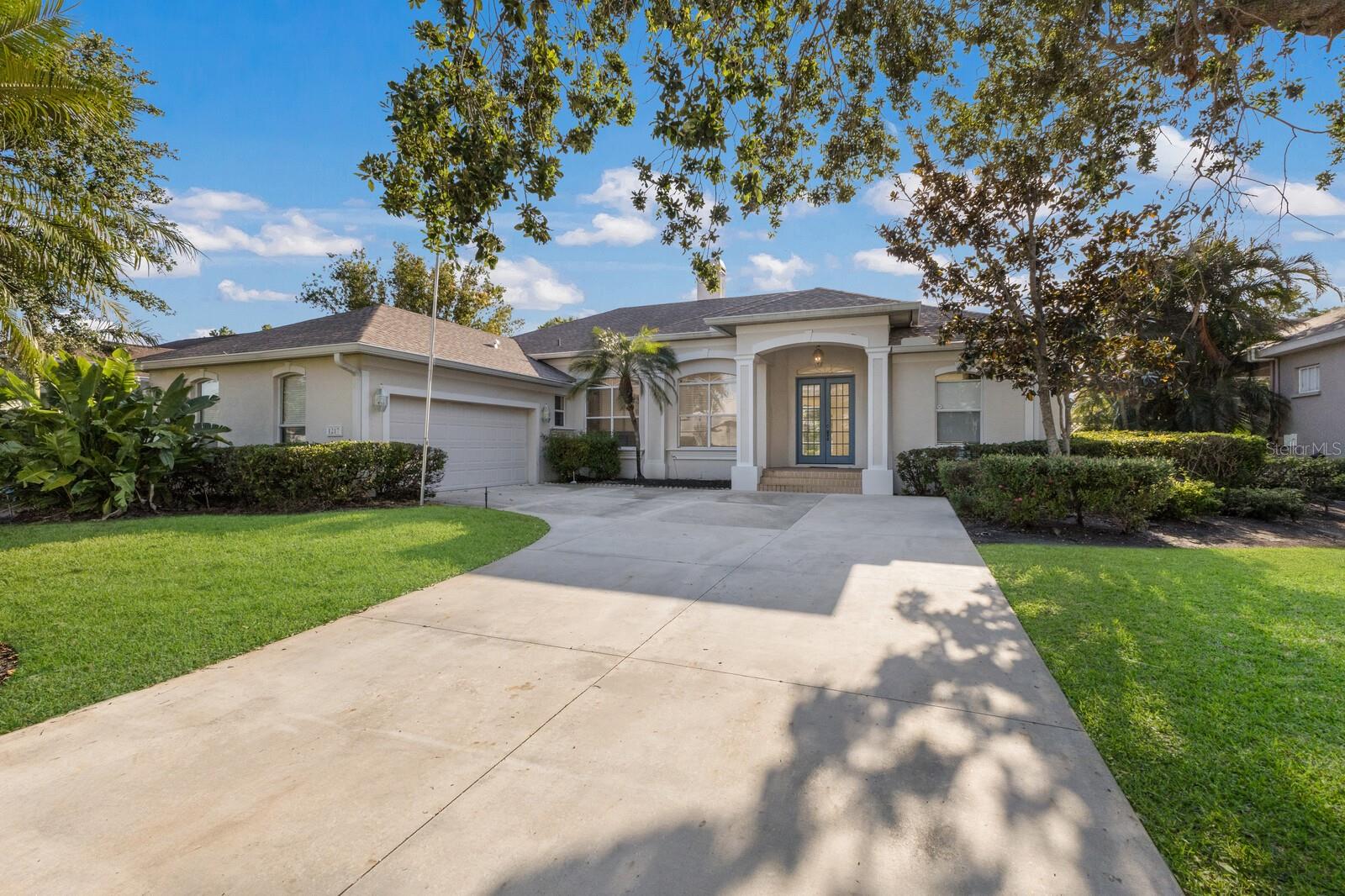 Welcome to Hawthorn Park, a well-established and highly sought-after community in Northwest Bradenton! Looking for an opportunity to live in an upscale neighborhood without the high price tag? This is your chance to add your personal design touch and build equity in a spacious 3-bedroom, 2-bathroom pool home with serene pond views, all while staying below market value. From the moment you arrive, you'll appreciate the ample driveway space and inviting curb appeal. Inside, the home boasts soaring ceilings and an open-concept living and dining area highlighted by a cozy, double-sided wood-burning fireplace. Expansive sliders provide beautiful views of the pool and pond, creating a seamless indoor-outdoor connection. The split floor plan offers privacy, with the spacious primary suite located just off the foyer. The primary retreat features an en-suite bath and private access to the pool area through sliding glass doors. The kitchen opens to a comfortable family room and casual dining space, with a nearby laundry room offering direct access to the garage. The secondary bedroom is oversized and perfect for a variety of living options. This home is full of potential and ready to be transformed into your modern dream home. Ideally located just minutes from Robinson Preserve, Desoto Memorial Park, Palma Sola Causeway (perfect for evening sunsets), and the award-winning beaches of Anna Maria Island.