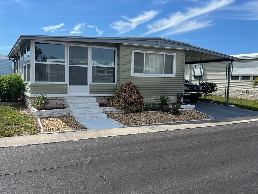 Photo of 36 Thatch Palm Street W, Largo, FL 33770 (MLS # TB8431643)