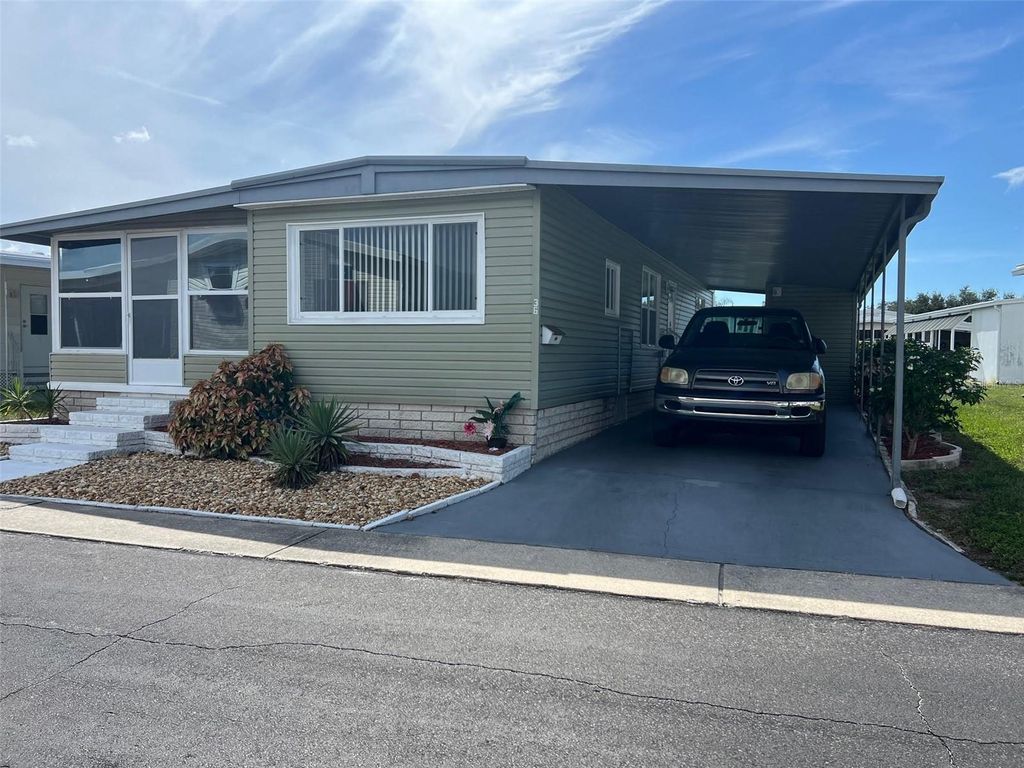 Photo of 36 Thatch Palm Street W, Largo, FL 33770 (MLS # TB8431643)