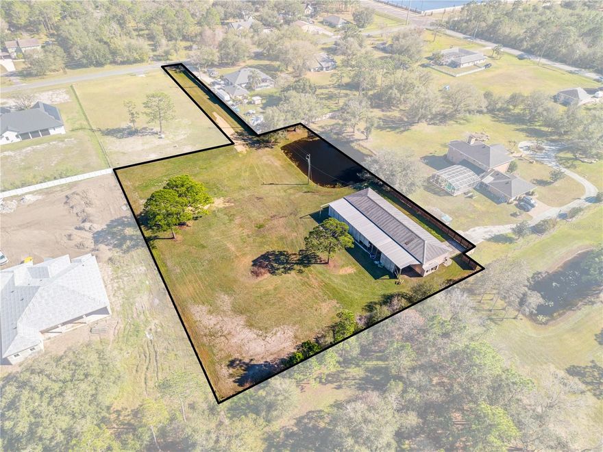 Come check out this unique 2.12 acres for sale. 100x30 wood SHOP. Private gate with 40ft driveway. A man cave or office with kitchen, bathroom and loft upstairs.  Wide open and ready for your vision — build your dream home, equestrian estate, or private getaway. Minutes from main roads with easy access. 12 ft garage door openings electrical and room for storage. 100x25 lean-to for RV or boat space! Come check it out and be amazed.