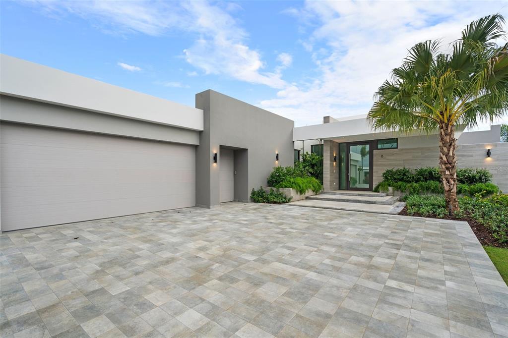 Brand new construction, one story, spacious home is located within the heart of the Sugarcane Golf Course. This four bedroom, four bathroom residence is immaculate and full of upgrades. Living is easy with an open floor plan. The main level entry with vaulted high ceilings leads to a formal dining room and spacious living room with recessed lights. The modern Italian-designed kitchen is the heart of the home, complete with large customized stone quartz countertops, a walk-in pantry, Thermador appliances, and light grey wood cabinetry.
The large master bedroom suite includes a spa bath with a soaking tub, separate shower, dual bowl vanity, and a private entrance to the backyard with an infinity edge pool. This modern residence also has a community shared power generator and solar water heater! A gorgeous landscaped yard and unlimited lake views will enchant you. Sit back, enjoy and call this your new home. Endless amenities await you at Dorado Beach Resort. This Isle is conveniently located to prime amenities such as golf courses, restaurants, a water park, fitness center, and many more!