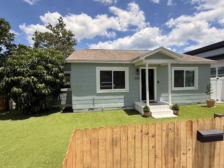 *Professional photos coming 5/15* Welcome to this charming and thoughtfully updated home in the desirable Oakwood Gardens neighborhood of St. Petersburg—located in a non-flood zone (X) with no storm issues during recent hurricanes, offering both peace of mind and convenience.

This 2-bedroom, 1-bath home features 1,144 square feet of versatile living space, including a dedicated enclosed home office and an additional bonus room—perfect for a playroom, gym, or flex space to fit your lifestyle. The open floor plan creates a seamless flow between living, dining, and kitchen areas, ideal for both everyday living and entertaining.

Inside, you’ll find original hardwood floors that add warmth and character, complemented by an updated kitchen with white shaker cabinets and stainless steel appliances. The bathroom has been tastefully updated with modern tile finishes. The enclosed office is filled with natural light thanks to large windows on two walls, creating an inspiring work-from-home environment.

Major system upgrades include a new roof (2018), A/C (2019), hurricane impact windows and front door (2024), and new water heater (2025) providing comfort and efficiency for years to come.

Step outside to a low-maintenance front yard with turf and a charming wood fence, while the spacious backyard offers privacy with vinyl fencing, 2 mango trees, a jack fruit tree and plenty of room for entertaining, pets, or future enhancements. Additional features include a front driveway and an oversized one-car garage with alley access.

Enjoy living on a quiet street just minutes from everything—less than 10 minutes to downtown St. Petersburg, 5 minutes to the bay, and approximately 20 minutes to the Gulf beaches. Walk or bike to local favorites like The Blend Coffee Shop, Golden Isles Brewing, and The Violet Stone.

With no HOA and a prime location close to dining, parks, and waterfront access, this home offers the perfect blend of charm, updates, and lifestyle.