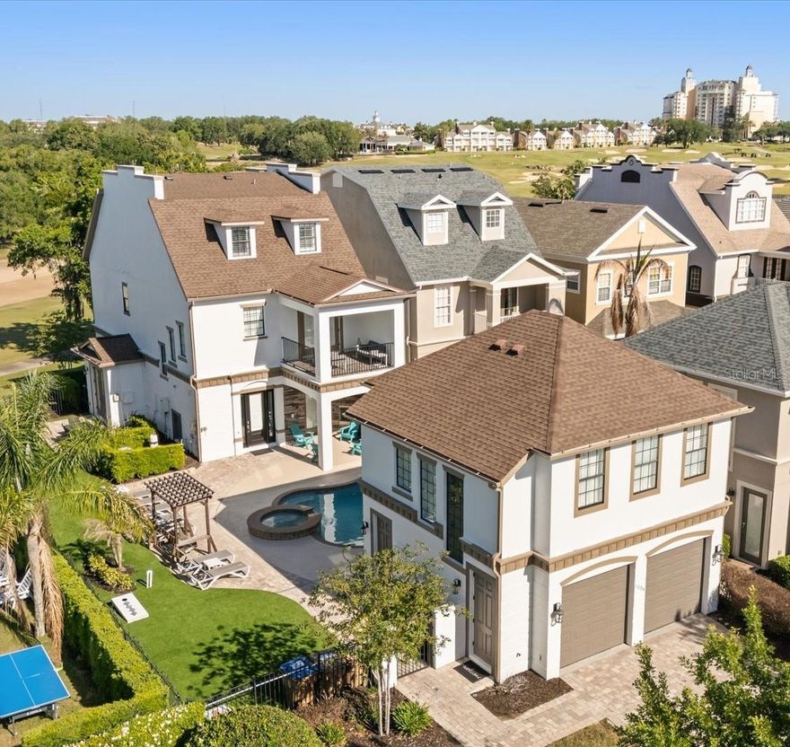 SELECT OPPORTUNITY TO SHOW ON 05/24, 05/26 and 05/27.  Luxury, Lifestyle and Legacy- The best parts of owning, living and vacationing in Reunion are on display at this Sunset Stunner!  Welcome to 1536 Corolla Court in the heart of Reunion’s Liberty Bluff Community.  This is A RARE 3 STORY HOME that showcases the “POSTCARD VIEW” from multiple balconies and allows you to overlook 7 HOLES of GOLF!  The property is also WEST facing which means you will never miss another Reunion Sunset again!  Take note that the lot is larger than normal which allows for more entertaining and outdoor area.  High-end artificial turf has been installed to maximize the space.  Along with an outdoor cooking area, a freshly painted pool deck and a multiple lounging chairs-this home is a sun worshipers dream!  This type of construction and layout will make you feel like you are getting 2 properties for the price of one.  Inside the first property you will find a fully equipped fun zone on the first floor filled with high-end gaming systems.  There is a private entrance just for the first floor and it is walls are lined with 2 sets of French doors that let you overlook the pool area.  A custom feature in this home.  The second floor also has a private entrance.  There you will find a well-appointed space with 2 bedrooms along with a kitchenette and a separate bathroom area.  Once inside the main house you will be drawn into how much natural light is inside.  The paint tones and colors have been chosen to create a calm and relaxed feeling. The open floor plan includes an indoor and outdoor dining space, a spacious kitchen and a comfortable living room all on the first floor.  You will also find a FIRST FLOOR BEDROOM with a private bath. There is also a separate ½ bath that doubles for a pool bath.  You can access the second floor via the wood tread staircase or take your own PRIVATE ELEVATOR.  There you will find additional bedrooms, with large private balconies along with a STAR WARS themed bedroom with bunkbeds.  The THIRD FLOOR is reserved for the primary bedroom and includes its own special oversized covered outdoor balcony designated for a cup of morning coffee or an evening glass of wine. You can also see the Reunion Grande Hotel in the distance. THIS PROPERTY HAS IT ALL!  This home does come with an ACTIVE REUNION RESORT MEMBERSHIP and is in a very active and SUCCESSFUL rental program. HUGE RENTAL AND MEMORY MAKING POTENTIAL. Reunion Resort has everything you want in a community including 3 signature golf courses, world class dining, waterparks, lazy river, water slides, firework viewing areas, tree lined streets, dog park, playground, driving range, golf simulator, member events, in-resort shuttle service, and event space. Live the resort lifestyle like a VIP. NO OTHER RESORT IN THE AREA HAS THIS!!!! Minutes to Disney and close to Beaches, Universal, Legoland and Sea World. Schedule a tour today. 80 million visitors are estimated to visit Orlando in 2026.  Welcome your family and friends in this home for years to come or take advantage of the demand for a rental home like this!  BOOKINGS ALREADY IN PLACE FOR 2026!