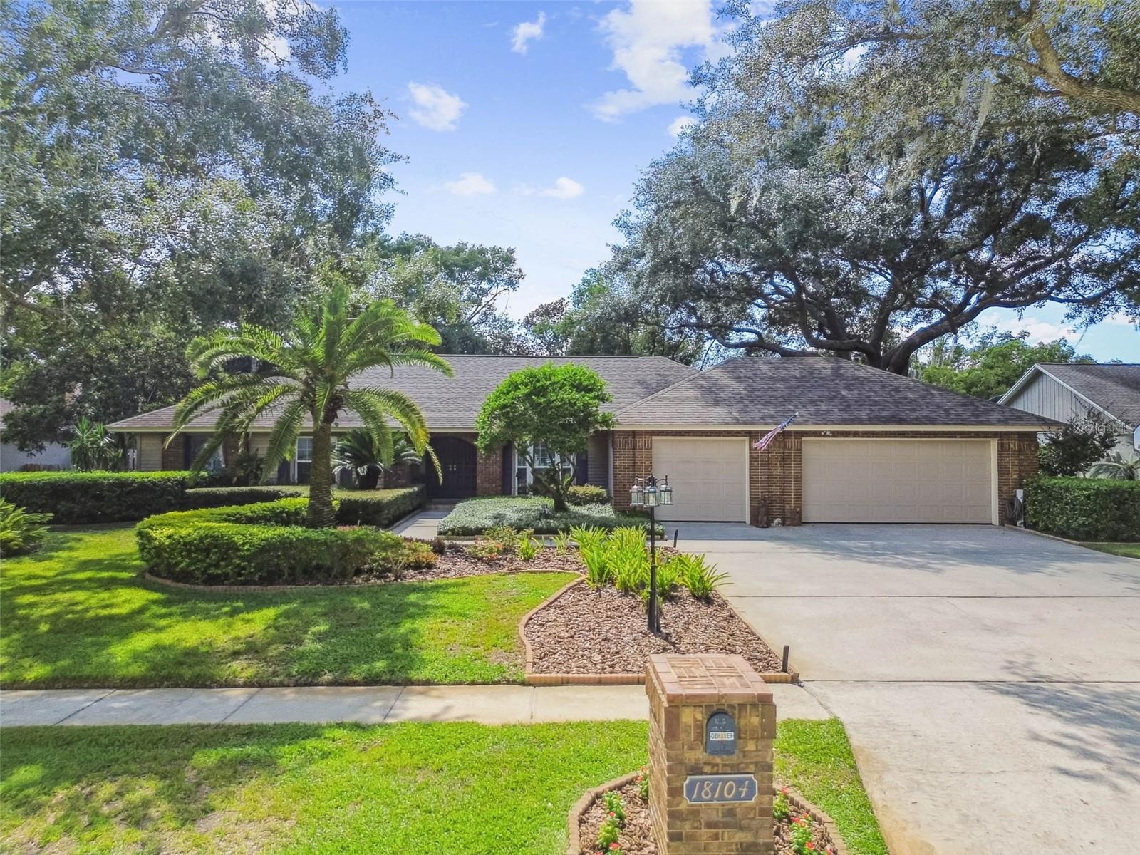 Step into a world where comfort, elegance, and Florida living come together in perfect harmony. This original-owner gem offers 4 generously sized bedrooms, 3 thoughtfully updated bathrooms, and a versatile 110 sq. ft. bonus flex room (not included in square footage) that’s ideal for a serene home office, fitness retreat, craft studio, or cozy guest space. From the moment you arrive, you're greeted by undeniable charm and curb appeal. Lush, freshly manicured landscaping, a welcoming lamppost, pressure-washed surfaces, and tastefully placed exterior lighting set the stage for the warmth and sophistication found inside. Subtle security flood lighting adds both beauty and peace of mind. Inside, the home exudes timeless appeal with Brazilian Cherry hardwood floors gracing select living areas, while the heart of the home—its stunning kitchen—delivers both function and flair. Featuring rich dark wood cabinetry, granite countertops, and sleek stainless steel appliances, this space is designed to inspire culinary creativity and casual gatherings alike. Each bathroom has been thoughtfully updated with tasteful vanities, designer mirrors, and on-trend lighting, creating spa-like sanctuaries throughout. Every corner of this home has been enhanced to reflect warmth, comfort, and practical elegance. Step outside into your very own backyard paradise—a spacious, private retreat that invites relaxation and celebration. Surrounded by mature landscaping and fruit trees, the saltwater pool sparkles under the sun, enclosed by brick pavers and a screened enclosure (2019) for all-season enjoyment. The fully equipped outdoor kitchen transforms everyday meals into alfresco feasts, perfect for entertaining under the stars. Whether you're hosting lively pool parties or enjoying peaceful morning coffee, this backyard is a true sanctuary. This home is more than just beautiful—it's exceptionally well-maintained, with recent upgrades that ensure peace of mind, including: Hurricane-rated windows throughout most of the home, Additional features include a spacious 2-car garage with additional dedicated garage space for workshop or motorcycle/golf cart flex area, a large laundry room with built-in cabinetry, abundant storage, modern lighting with dimmers, and a 7-zone irrigation system to keep the landscaping thriving. Residents of The Manors at Crystal Lakes can enjoy this highly coveted neighborhood behind 24-hour guard gated entrance. With access to tennis/pickleball courts, a clubhouse, a playground, and a strong sense of community brought to life by year-round neighborhood events and gatherings. Zoned for Steinbrenner High School and close to top-rated charter schools, this location offers a rare blend of privacy, prestige, and proximity—just a short drive to Tampa’s amenities and the white-sand beaches of the Gulf Coast. Homes of this caliber rarely come available—schedule your private showing today and experience the lifestyle you’ve been waiting for. This is more than a house—it’s a place where memories are made, where every corner tells a story of care, love, and pride. A rare find that blends quality, character, and an exceptional Florida lifestyle.