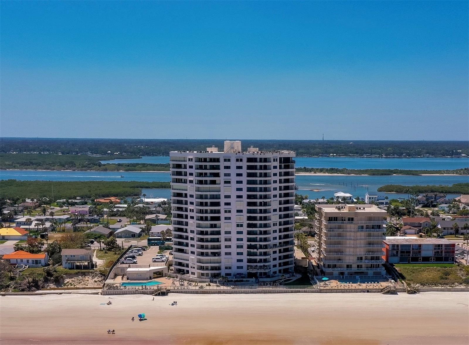 This beautifully remodeled 2-bedroom, 2 bathroom unit in the sought-after Seychelles condominiums offers 1,555 square feet of stylish coastal living with direct oceanfront access. Positioned directly on the no-drive beach, this move-in ready residence offers the best of coastal living - complete with three private balconies that showcase panoramic views of the Atlantic Ocean and the Intracoastal Waterway. Comes completely furnished and all new sliders and windows throughout! The thoughtfully redesigned interior features an open layout with a seamless flow between the kitchen, dining, and living areas. The kitchen is beautifully appointed with white shaker cabinetry, granite countertops, stainless steel appliances, and modern pendant lighting, flowing seamlessly into the living and dining areas. Sliders lead to the expansive balcony where you can relax with coffee in the morning or enjoy ocean breezes all day long. The spacious primary suite includes dual balcony access, a walk-in closet with custom shelving, and an expanded en-suite bath with dual vanities, and a spa-inspired walk-in shower. The guest suite also enjoys its own balcony with serene Intracoastal views and an updated guest bath with sleek finishes. Enjoy resort-style amenities including a heated oceanfront pool, indoor spa, sauna, fitness room, barbecue area, and an elegant penthouse-level clubroom. The building offers secure underground parking, elevators, and well-maintained common areas. This furnished unit provides the perfect balance of modern design and coastal comfort. Ideally located near oceanfront dining, shopping, and entertainment, as well as local attractions like the Historic Ponce Inlet Lighthouse, the Marine Science Center, and scenic parks. All information recorded in the MLS is intended to be accurate but cannot be guaranteed.