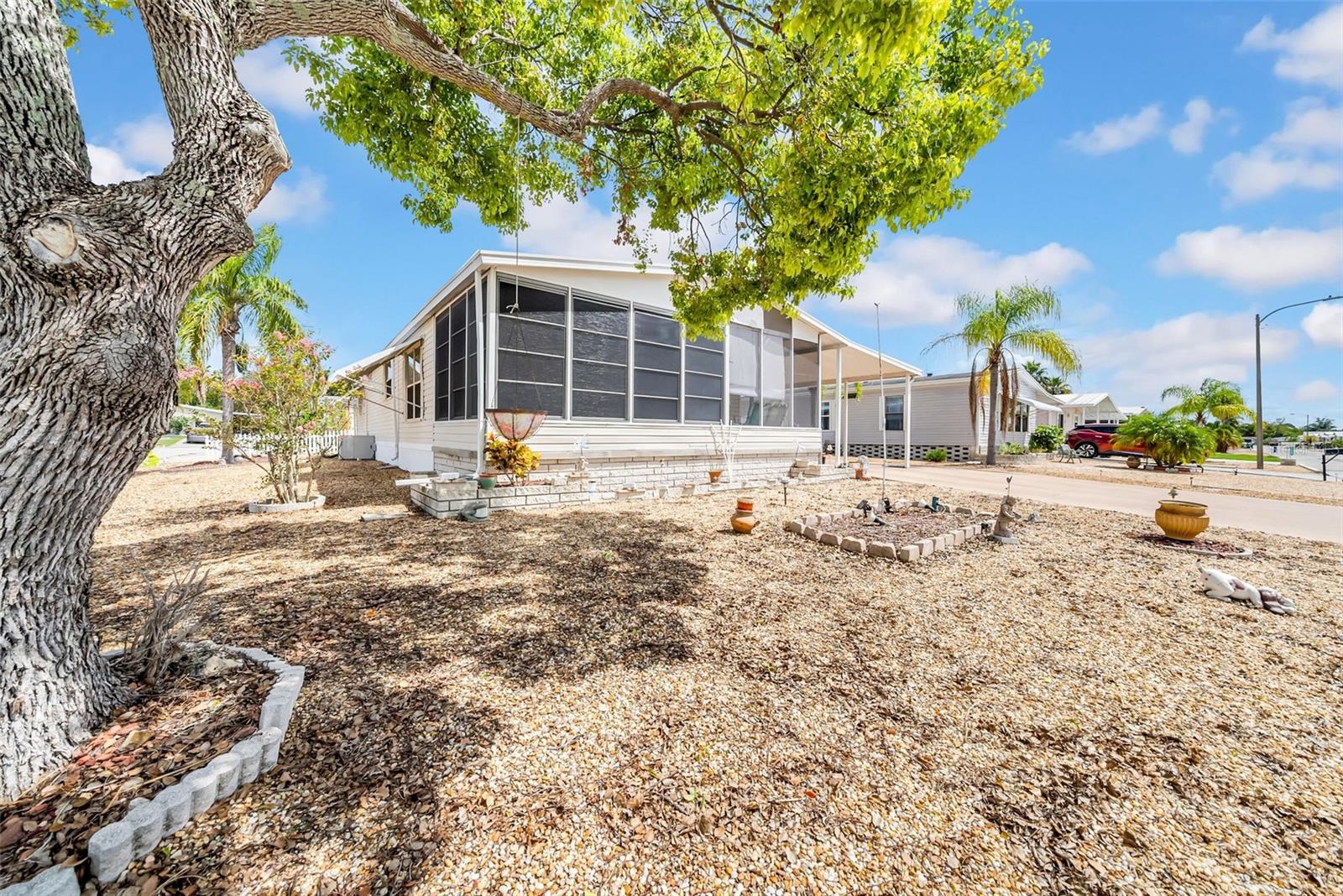 Spectacular home in the highly sought after community of Ponderosa Park where you own the land your home is on (no surprise lease hikes here) and incredibly low HOA at only $250 a year!! This amazing and spacious home has it all, two lanais', large eat in kitchen with a pantry that will be the envy of others and so much more and easy to clean linoleum flooring! The dining room and living room have an open concept that makes this home feel even more spacious! Indoor laundry is always wonderful to have so this home has it all. The master boasts a large walk-in closet that has plenty of room for all your clothes and then some! Low/no maintenance yard so you can spend your free time at the amazing clubhouse, pool or outdoor games area. No one gets bored in this community! So many events and let's not forget the large, heated pool as well! This home is waiting for the right buyer to come and make it their own. It comes with all that you see so all you need to do is bring your imagination and your toothbrush and get started enjoying the Florida life!!