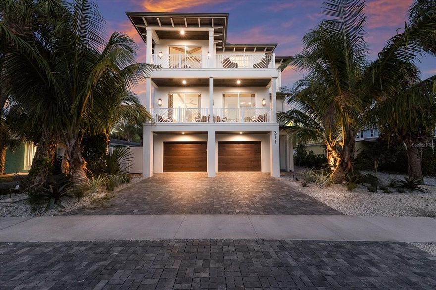 Welcome to Go With The Flow, a brand-new, luxurious five-bedroom, five-and-a-half-bath retreat that blends modern opulence with a vibrant beachside charm.

Designed for ultimate relaxation and entertainment, this stunning property features an unparalleled Lazy River-style pool with an in-ground spa, offering the perfect setting to bask in the radiant Florida sunshine.

Step inside to discover an immaculate chef’s kitchen, fully equipped with high-end appliances and everything needed to craft gourmet meals. A sleek bar area with a wine fridge and an elegant formal dining space add to the home’s sophisticated allure. The spacious living area invites you to unwind, with contemporary sofas, stylish side chairs, and a Smart TV for endless entertainment.

Each guest room is a private oasis, thoughtfully designed with crisp linens, ample storage, and personal televisions. The primary suite is a sanctuary of luxury, featuring a king-sized bed, plush bedding, and an ensuite bathroom complete with a double vanity, soaking tub, and walk-in shower. Additional accommodations include three king guest suites, each with a private ensuite bath, and a bunk room designed for younger guests, also with its own ensuite. A washer and dryer add extra convenience for extended stays.

Venture up to the rooftop deck and experience breathtaking views paired with unbeatable entertainment. With ample seating, a stylish bar area, and a versatile 3-in-1 game table, it's the perfect spot for unforgettable nights under the stars.

Ideally situated in the heart of Anna Maria, this exquisite retreat is just a short stroll from the beach, charming local restaurants, boutique shops, and iconic destinations like Pine Avenue and the AMI City Pier.

Escape to Go With The Flow for unforgettable beach days, endless relaxation, and memories to last a lifetime!