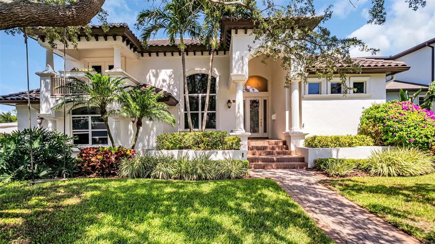 Gorgeous Mediterranean-style pool home nestled in the highly sought-after Snell Isle Eden Isles neighborhood! Built in 2005, this residence showcases a durable tile roof, thoughtful architectural details, and quality craftsmanship throughout. The expansive layout offers both formal and casual living spaces, generous bedroom sizes, and an abundance of natural light that enhances the home’s inviting ambiance. Handsome hardwood and tile flooring flow throughout the main living areas, while large windows and French doors frame views of the sparkling pool, spa, and lanai. The custom island kitchen features rich wood cabinetry, granite countertops, and a breakfast bar that opens seamlessly to the family room, dining nook, and outdoor living area—ideal for both everyday comfort and effortless entertaining. The downstairs primary suite overlooks the pool and includes a light-filled spa-like ensuite and an exceptional walk-in closet with custom built-ins. A second bedroom on the main level enjoys access to a full bath, offering perfect flexibility for guests. Upstairs, a private den/office leads to a charming balcony with picturesque views, accompanied by a rare 12' x 20' climate-controlled storage room. The screened, heated pool and spa feature a PebbleTec finish, pool sweep, and covered lanai—your own private oasis ready for year-round enjoyment. Additional highlights include an inside laundry room with extra storage and a side-entry three-car garage with paver driveway and walkway. Experience the best of the Florida and Sunshine City lifestyle—just moments from premier restaurants, boutique shopping, waterfront parks, vibrant Downtown St. Petersburg, and a short drive to the Gulf’s world-famous beaches.