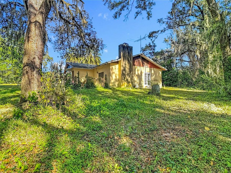Discover this timeless 2-bedroom, 2-bath block home featuring a wood-burning fireplace and a desirable split floor plan, perfectly tucked away in a private, peaceful setting on 19± acres (MOL) with 660 feet of paved road frontage.
The property consists of two parent parcels (12.80 acres and 6.1 acres), totaling 18.90 acres, each eligible to be subdivided into 2.5-acre parcels. A natural spring originates and winds through the land, enhancing its serene and picturesque character.
The landscape offers a stunning blend of woodlands, diverse native flora, pasture, and mixed forest, and was formerly operated as a horse farm, as evidenced by once used rustic horse stall structures located throughout the property. The land features gradual sloping topography toward the south, providing excellent natural drainage, and the property has experienced no flooding during heavy rains.
This property is zoned AG, the property supports agricultural use. 12 acres qualify for Greenbelt tax reduction, with a portion of the land (southeast corner) benefiting from an existing tax-reduced status that transfers to the new owner.
Ideally located with convenient access to Tampa, Ocala, and the Suncoast Highway/Veterans Expressway, this property offers the perfect balance of seclusion and accessibility. All major shopping is just minutes away, along with Brooksville Regional Airport (12 minutes) and two major hospitals—HCA Florida Oak Hill Hospital (11 minutes) and Tampa General Hospital of Brooksville (15 minutes)—providing everyday convenience and peace of mind.