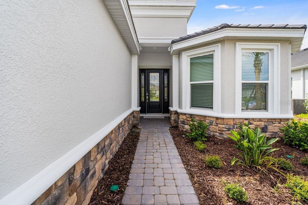 Photo of 4704 Isonzo Way, Wesley Chapel, FL 33543 (MLS # TB8404741)