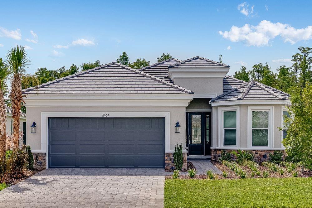 New Construction - Ready Now! Built by Taylor Morrison, America's Most Trusted Homebuilder. Specifically designed for 55+, Esplanade at Wiregrass Ranch offers an unparalleled resort-style living experience! Enjoy a lifestyle enriched by wellness programs and luxurious amenities that revitalize the mind, body, and spirit. From wine tastings and gourmet dining experiences to live concerts and exciting excursions, Esplanade provides thoughtfully curated activities to enhance and elevate every aspect of your daily life. Welcome to the Lazio at 4704 Isonzo Way in Esplanade at Wiregrass Ranch. This home offers 2,375 sq. ft. of thoughtfully designed living space with 3 bedrooms, 3 full baths, a study, and a three-car tandem garage. From the welcoming foyer, you’re guided into an open-concept layout featuring a dining room and a spacious gathering room filled with natural light. The gourmet kitchen, complete with a large island and designer finishes, flows seamlessly into the great room and opens to a covered lanai—ideal for relaxing or entertaining outdoors. The primary bedroom features a beautiful bay window that adds space and natural light. The adjoining bath includes dual sinks, a large shower, a private water closet, and a generous walk-in closet. Additional Highlights Include: tandem garage, gourmet kitchen, extended covered lanai, laminate flooring in bedrooms and all high traffic areas, quartz countertops throughout. Photos are for representative purposes only. MLS#TB8404741