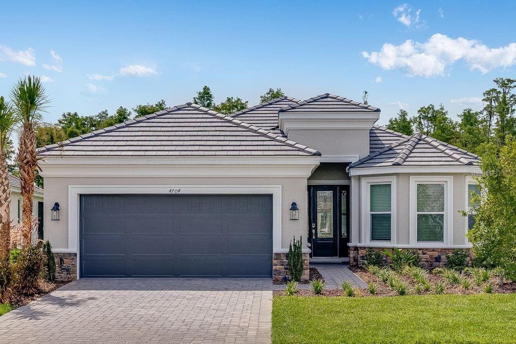Photo of 4704 Isonzo Way, Wesley Chapel, FL 33543 (MLS # TB8404741)