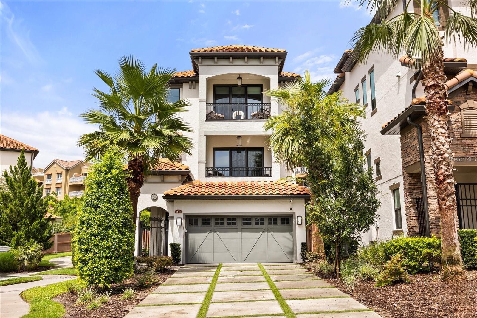 This charming 4 bedroom, 3.5 Baths Single Family Home for rent located at 7675 Toscana Blvd. Orlando, FL 32819. This home has a Range, Refrigerator, D/W, Disposal, Central A/C. STUNNING three-story estate home in Lakeside at Toscana, a secure gated community on Spring Lake in desirable Dr. Phillips. The interior design reflects a fresh contemporary look in its features, finishings and color tones, and the floors are connected via both stairs and PRIVATE ELEVATOR. The main common living space is on the second floor and provides WOW factor at every turn. Here your gourmet style kitchen/dining space is open to the living room. The kitchen boasts quartz counters, breakfast bar, island, gas range w/pot filler, abundant cabinetry/pantry space, striking pendant lighting, eat in nook and more formal dining space designed to seat a crowd. Other notable features on this level: electric fireplace, half bath and balcony. The top floor includes three of the four bedrooms. The primary suite is in the front, with a balcony view of Spring Lake and a spot to watch theme park fireworks. Here you’ll enjoy a luxurious ensuite bath w/dual sink vanity, soaker tub & oversized shower w/multiple shower heads. The ground floor is designed as a secondary entertainment spot – a large great room with bar – flexible to arrange as you see fit. There’s also a bedroom and full bath here – ideal for a guest, or perhaps the perfect spot to set up your office. Other notable interior features: quartz counters are also found in the full baths, laundry room and wet bar areas. The ground floor great room provides access to your backyard. Here, you have stylish outdoor entertainment center – open and covered patio space that’s great for dining, relaxing, TV viewing, gathering around the firepit and even doing a little putting! Fencing and bamboo trees provide you with the privacy you’d want when enjoying fun in the sun. Great location - residents of Toscana have access to their community pool and fitness center, and landscaping is taken care of for you. Only a mile to I-4, essential shopping venues, and the area’s well-known “Restaurant Row.” Theme park lovers will also appreciate the proximity to Universal Studios, Sea World, and Disney. This is luxury living at its finest – come see all that makes this home so special.