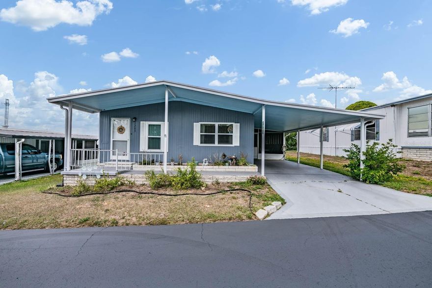 Welcome to the desirable Spanish Trails Senior Village, an active gated 55+ community where comfort, convenience, and Florida living come together beautifully. This nicely updated 2BR/2BA home offers an inviting open-concept layout between the kitchen, dining, and living rooms, creating the perfect space for entertaining family and friends. The thoughtfully designed kitchen features a charming pantry nook complete with a coffee bar and additional cupboard space, giving you both style and functionality. The spacious living room boasts laminate flooring, a ceiling fan, and easy access to the covered front porch where you can relax and enjoy your morning coffee. The owner’s retreat offers laminate flooring, ceiling fan, walk-in closet, and a private en suite bathroom featuring a step-in shower for added comfort and convenience. Bedroom two also includes laminate flooring, ceiling fan, built-in closet, and private access to the guest bathroom with tub/shower combo, making it ideal for overnight guests. One of the favorite gathering spaces in the home is the large 12x17 screened room at the front of the carport, providing the perfect place to unwind, entertain, and enjoy the pleasant Florida breezes year-round. Just off the screen room you’ll find the laundry area complete with washer, dryer, and plenty of shelving for extra storage. Major updates including a membrane roof and new AC system in 2023 provide peace of mind for years to come. Conveniently located in the heart of Zephyrhills, you are close to shopping, restaurants, and premier medical facilities. Plus, you’re just a short drive from Tampa International Airport, St. Pete–Clearwater International Airport, and some of Florida’s most beautiful Gulf Coast beaches. Schedule your private showing today and start enjoying the active Florida lifestyle you’ve been dreaming about!