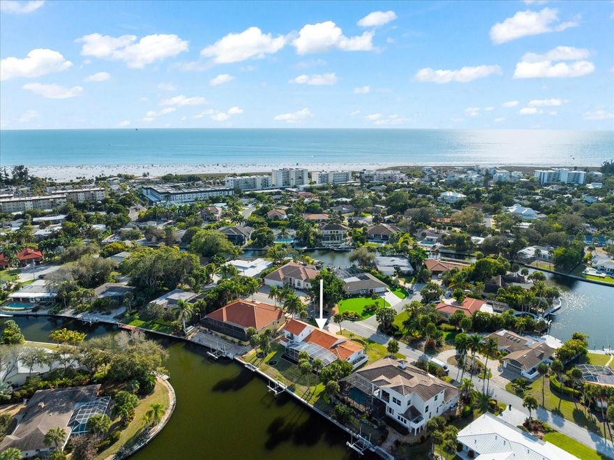 Welcome to your dream waterfront home in the highly coveted Siesta Isles canal community is a prime location of Siesta Key. Where you will experience the tranquility of this coastal neighborhood which is its own Island within an Island features many dead-end streets providing a peaceful environment for you and your family. This residence is located in the confluence of two canals, with 98 liner feet of waterfront. You'll enjoy wide breathtaking water views and have endless opportunities for water activities and boating adventures. Complete with a boat lift, dock for paddle boarding, kayaking, jet skiing, or fishing right from your backyard. Imagine starting your day with a beautiful sunrise followed by just an 8-minute walk to the main entrance of Siesta Key Beach where you will take a leisurely stroll on the white crystal sands. Spend your evenings fishing for snook, relax by the heated pool and watch the manatees and dolphins playful show or take your boat out for a short 15 minute sunset cruise to Sarasota Bay. On Sundays you can join and experience the traditional Drum Circle on the beach. 5455 Azure Way boasts 3 bedrooms, 4 bathrooms (2 en-suites), in the spacious layout with 2,736 Sq ft of living space which has been freshly painted white, inside and out, adding a modern touch of elegance and class. The open concept with high ceiling and abundance of natural light creates a bright and airy atmosphere. A generous living room-dining room combo can be ideal for entertaining guests. White modern kitchen features stainless steel appliances, double oven, tile backsplash, granite and tall cabinets provide abundance of storage. The original master bedroom is on the ground level, while the current master upstairs offers privacy and stunning views from the front and back balconies. The office/den with a full bathroom offers versatility and functionality, making it ideal for remote work or guest accommodations (with the option to convert it into another en-suite if desired). Open the large sliding glass doors for a seamless blend of indoor comfort with outdoor oasis. The screened-in brick patio offers ample room for living and dining or entertaining. Immerse yourself in the heated pool, for relaxation and rejuvenation. Whether you're enjoying a swim, simply lounging by the water's edge or enjoying a peaceful evening under the stars, everyday will feel like a vacation.Elevate your lifestyle experience and make this aspiration become your reality today!