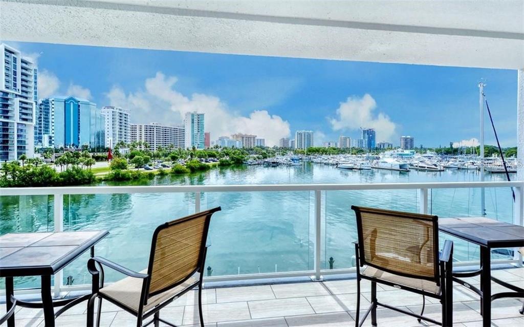 FABULOUS SUMMER RENTAL IN GATED BOUTIQUE BUILDING OF ONLY 14 RESIDENCES. AVAILABLE 4/15/2025 THROUGH 11/30/2026. 3 month minimal and if LESS THEN A 6 MONTH RENTAL A 12% tax fee will be charged. FABULOUS UNOBSTRUCTED MARINA VIEWS, FULL BAY VIEWS AND TWINKLING CITY LIGHTS. GOLDEN GATE POINT IS A 22 ACRE PRIVATE PENINSULA. WALK 4 BLOCKS TO DOWTOWN SARASOTA FOR CUISINE DINING, BOUTIQUE SHOPPING, OPERA, FLORIDA STUDIO THEATRE AND MARINA JACKS. 1 MILE WALK OR BIKE ACROSS RINGLING CAUSE WAY BRIDGE TO FAMOUS ST. ARMANDS CIRCLE AND LIDO BEACH. THIS HOME HAS ALL GRANITE COUNTERTOPS, TILE FLOORS, EXIT TO YOUR ENORMOUS OUTDOOR COVERED LANAI TO ENJOY THE MOST BEAUTIFUL SUNRISE AND ACTIVITY THAT SARASOTA BAY FRONT HAS TO OFFER. A 2 BEDROOM, WITH LARGE DEN ALSO SET UP AS BEDROOM HAS 2/1/2 BATHS HAS A OPEN FLOOR PLAN WITH FLOOR TO CEILING SLIDERS AND WINDOWS. COMPLETELY TURNKEY FURNISHED SO JUST BRING YOU TOOTHBRUSH. ENTERTAINING AT ITS BEST IN YOUR CHEFS KITCHEN WITH ISLAND FOR GUESTS OPEN TO DINING AREA AND GREAT ROOM. ENJOY THE HEATED POOL, OUTSIDE RESTROOMS, GRILLING AND FISHING AT THE DOCKS AND JUST TAKE A STROLL AROUND THE CIRCLE OF GOLDEN GATE AND MEET YOUR LOVELY NEIGHBORS. 2 PARKING SPOTS UNDER BULDING. OWNERS HERE TAKE PRIDE IN MAKING HARBOR VIEW ONE OFF THE BEST COMPLEXES ON GOLDEN GATE. A PLACE TO CALL HOME IN PARADISE.