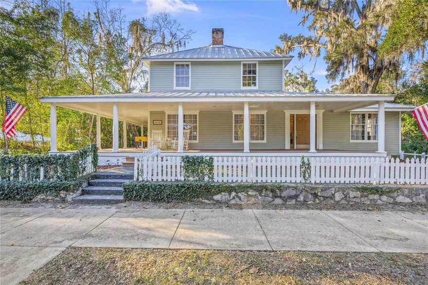 Showstopper! This unbelievable historic property is located in the heart of High Springs, Florida, offering a rare blend of timeless character, thoughtful updates, and modern comfort. Featuring 4 bedrooms and 3.5 bathrooms, the home includes an additional downstairs primary suite, ideal for a mother-in-law suite, guest quarters, or private retreat.
Inside, you’ll find intricate trim work, detailed molding, tray ceilings, and truly unique architectural features throughout. The interior and exterior have been freshly painted, while major systems provide peace of mind, including a metal roof taken down to the rafters in 2018 and HVAC replacement in 2018 with a dual-zone system that contributes to low energy bills year-round.
Large windows throughout flood the home with natural light, including the primary bedroom, creating a serene and inviting atmosphere. Enjoy soaking in the bathtub while taking in peaceful views of nature. A long, jaw-dropping dining room is perfectly suited for hosting, while an upstairs reading nook with built-in bookshelves offers a cozy escape. One guest bedroom features a stunning cathedral ceiling, and a wood-burning fireplace adds warmth and classic charm.
Outdoor living is just as impressive with a large, wide wrap-around front porch and a fenced backyard. The kitchen is equally spectacular, featuring a gas stove, stainless steel appliances, and an abundance of windows lining the entire space.
Zoned C2, this property opens the door to numerous possibilities, including short-term rentals or a Bed & Breakfast. Enjoy a walkable location to Downtown High Springs’ restaurants, brewery, and shops, and easy access to world-class springs for diving, swimming, canoeing, and hiking. Conveniently located just 20 minutes from Gainesville and a stress-free 10-minute drive to I-75.
A truly rare opportunity to own an iconic property in one of Florida’s most charming and sought-after communities.