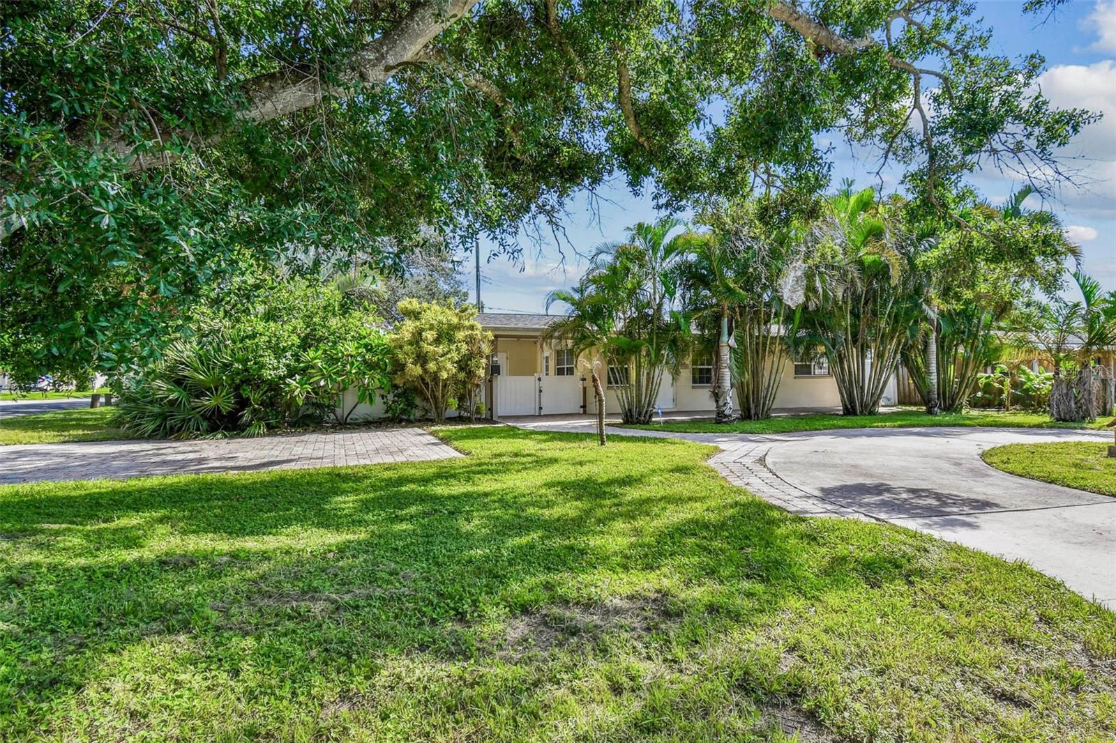 Welcome to this charming 3-bedroom, 2-bath home perfectly situated on a highly sought-after corner lot with a fully fenced backyard! From the moment you arrive, you’ll be greeted by lush tropical palm trees and a welcoming front entryway that sets the tone for Florida living.
Step inside to find a bright, open living and dining area filled with natural light, perfect for both relaxing and entertaining. The dining space flows seamlessly into the kitchen, featuring stainless steel appliances, a double sink, and solid wood cabinets with two convenient lazy susan's for extra storage.
This home offers a desirable split floor plan, providing privacy for everyone. Two spacious bedrooms with large closets share a full bathroom down the hall, while the primary suite is tucked away off the kitchen. The primary bedroom boasts a walk-in closet, a private en-suite bath, and an additional bonus room—ideal for a home office, workout space, nursery, or other bedroom.
A separate large utility room with a washer and dryer adds convenience, while the fully fenced backyard is perfect for pets, outdoor entertaining, and family barbecues.
Located in a great neighborhood and truly move-in ready, this property is a hidden gem that offers comfort, flexibility, and the perfect Florida lifestyle. Don’t miss your chance to make this beautiful home yours!
