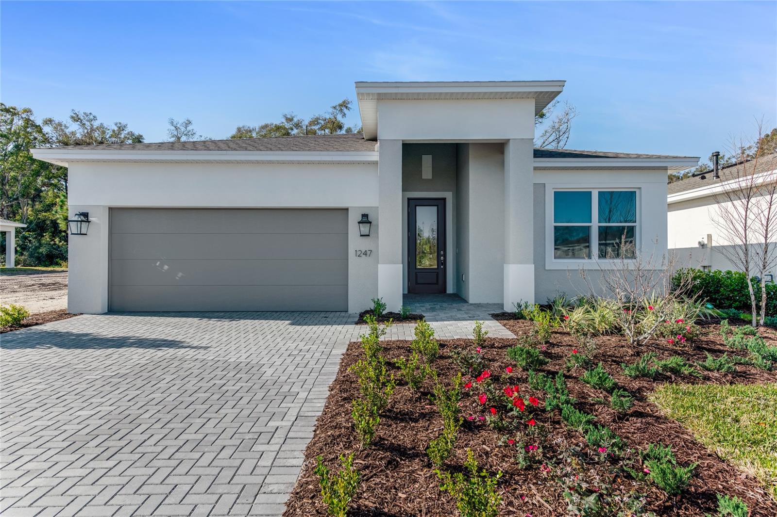 ***NEW CONSTRUCTION***Welcome to the Morgan floorplan, a thoughtfully designed 3-bedroom, 3-bath home that offers both style and functionality. This home includes a versatile flex room, perfect for hobbies, guests, or a quiet retreat. The expansive Great Room, with its elegant tray ceilings, creates an inviting space that flows seamlessly into the heart of the home, the gourmet kitchen. Here, you'll find luxury veined quartz countertops, a gas cooktop, wall oven, and stainless-steel appliances, along with a chimney-style exhaust hood and artisan backsplash tile in a picket design. Additional storage is provided with a pot and pan cabinet and a 24” deep cabinet above the refrigerator with a side panel.
The Owner’s Suite offers privacy and comfort, featuring an oversized walk-in closet and a spacious bath with split vanities and a frameless shower enclosure. The bath also boasts tile-to-the-ceiling in the shower for a sleek, modern touch. A second frameless shower enclosure is featured in Bath 3 for added luxury.
Enjoy peaceful mornings or evenings on the rear lanai, which is surrounded by natural beauty, providing the perfect setting for relaxation. With a designer glass front door creating a welcoming entry, this home seamlessly combines elegant design and practical living.
The Morgan offers a smart, low-maintenance layout that is perfectly suited for a relaxed, refined lifestyle, just steps from community amenities and designed for effortless living.